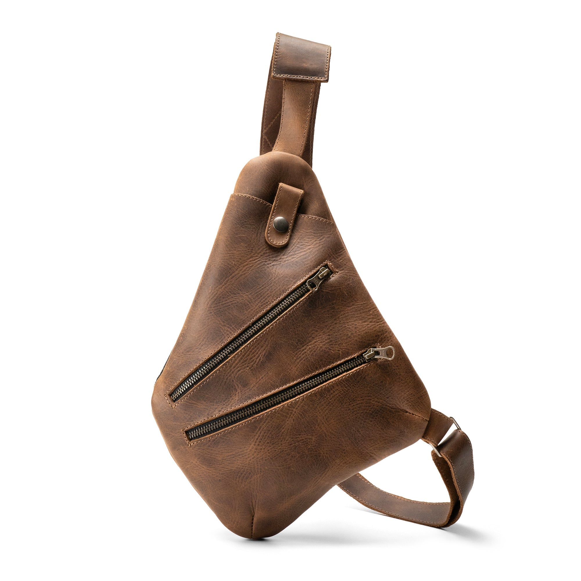 Stylish Kidney Shoulder Bag by Hide & Drink, a trendy Everyday Crossbody Bag crafted from premium Full Grain Leather. This handmade bag showcases artisan quality with hand cut and hand sewn details, featuring a durable design perfect for daily essentials. Made with care in La Antigua Guatemala & Oaxaca Mexico.