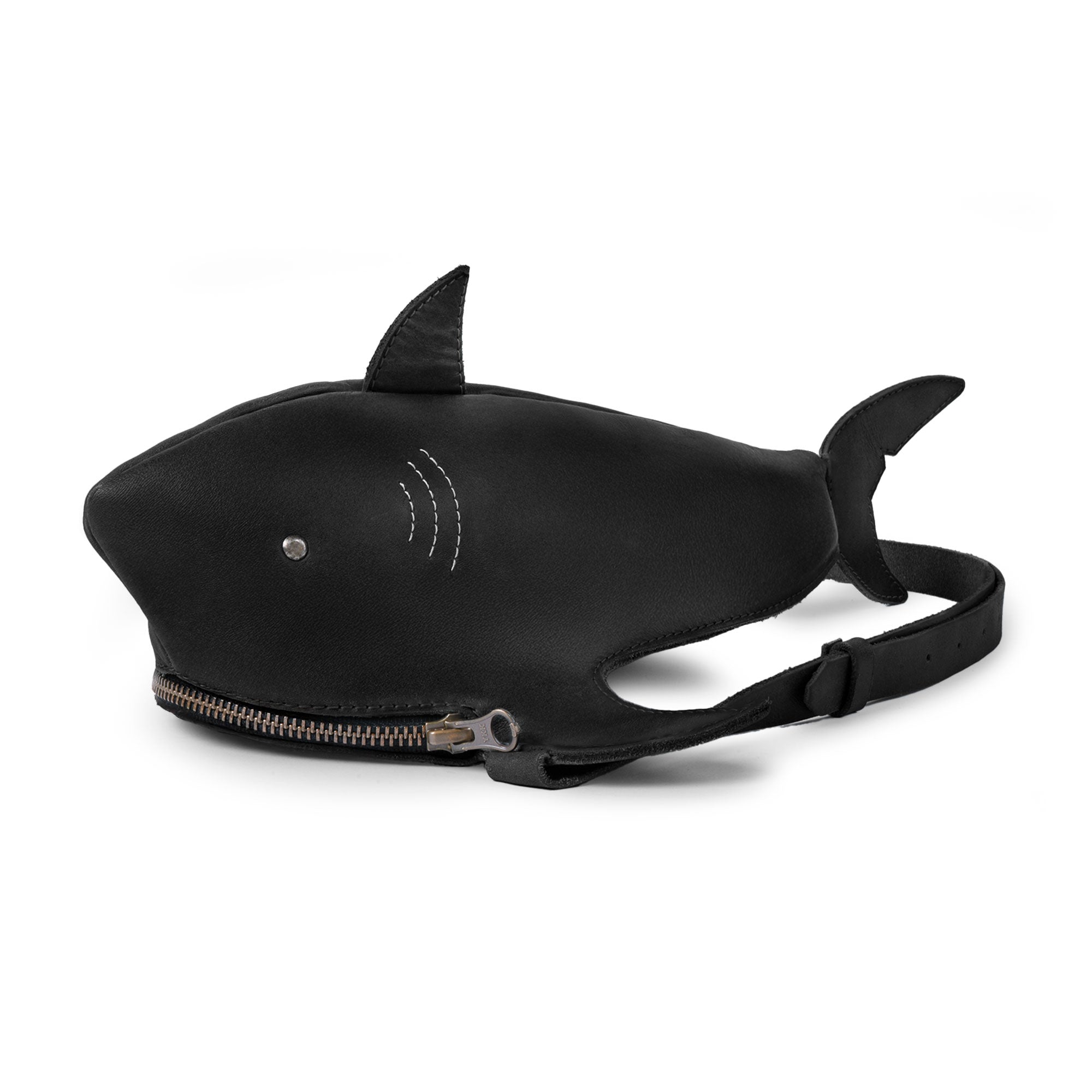 Shark-Shaped Shoulder Bag by Tudi Frudi featuring a unique shark design in Full Grain Leather, showcasing a compact yet stylish look. Perfect as a Crossbody Bag or Messenger Bag, this handmade bag is crafted with artisan precision in La Antigua Guatemala and Oaxaca Mexico.