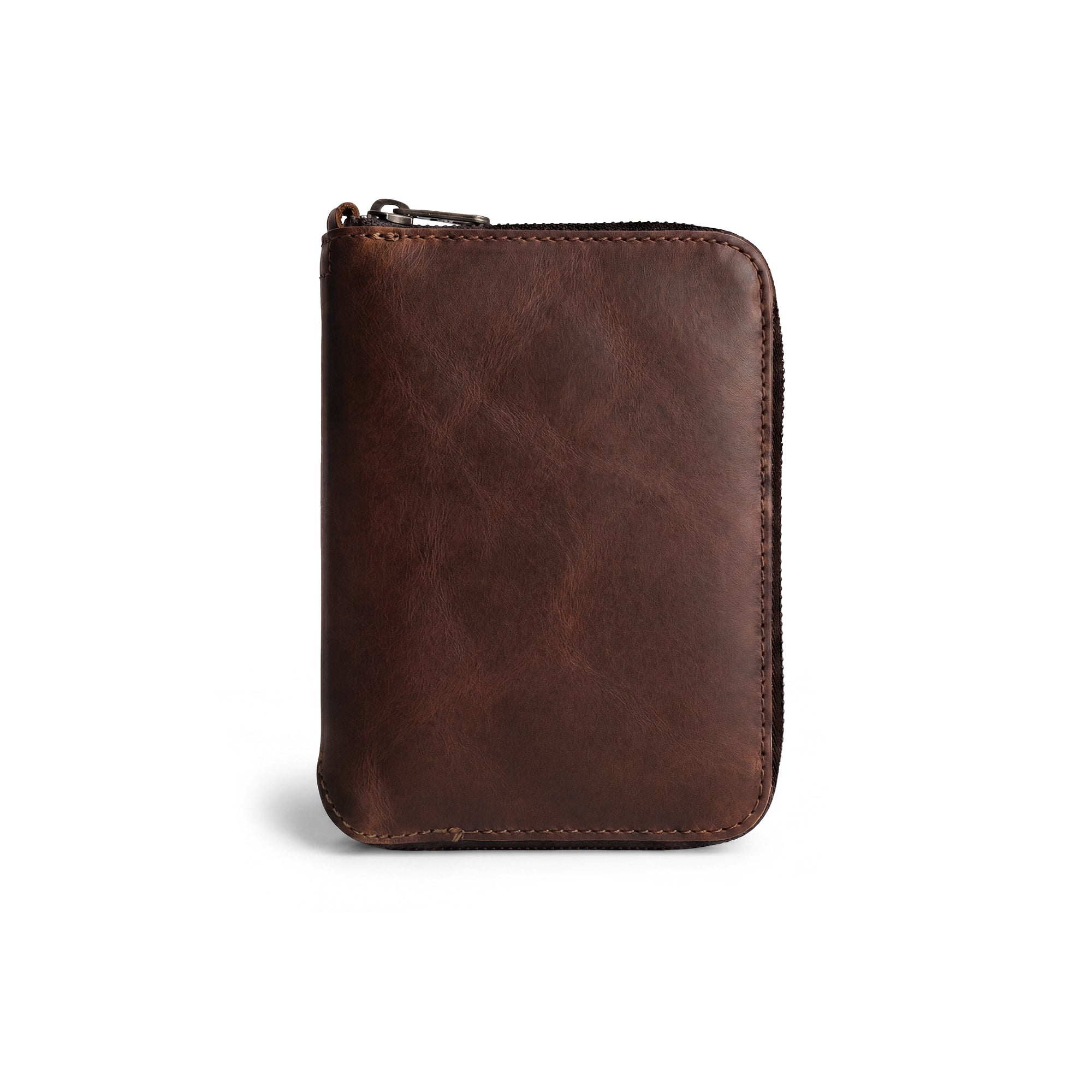 Front view of the Zippered Passport Wallet by Hide & Drink showcasing its rich, brown Full Grain Leather, perfect for stylish travel. Zippered Passport Wallet Handmade from Full Grain Leather - Storage Case for Identification, Credit Cards, Cash Full Grain Leather, StockyardX, Small Batch Production, Hand Cut, Hand Sewn, Fire Branded, Artisan, Handmade in La Antigua Guatemala & Oaxaca Mexico.