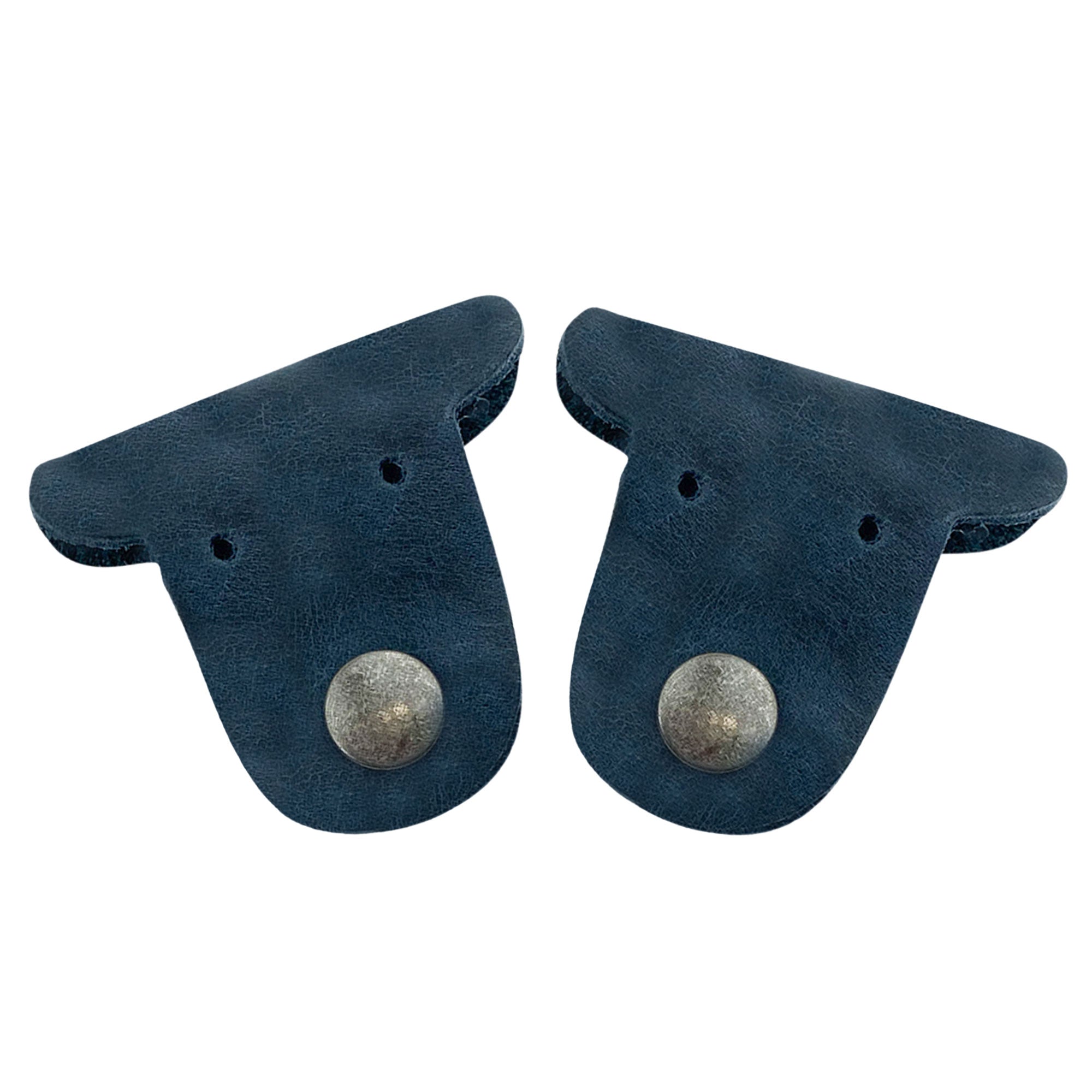 Two navy blue Dog Cord Keepers by Taco Dog, perfect for wrapping your cables and keeping them organized. Made from full grain leather, these handmade accessories feature clip snaps for easy travel management. Enjoy the artisan craftsmanship of La Antigua Guatemala with this charming duo.