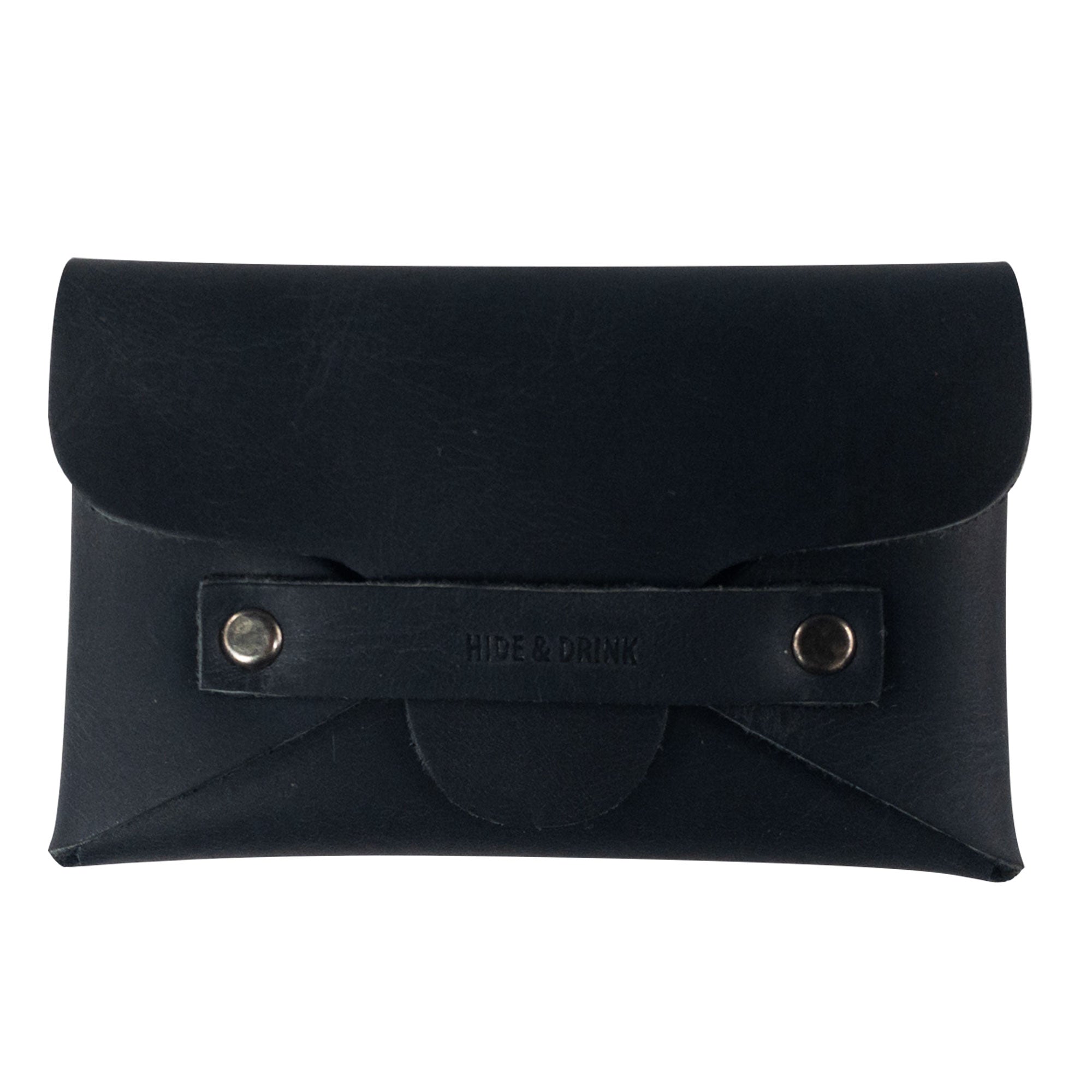 A sleek Snapless Business Card Holder from Hide & Drink, showcasing its elegant exterior design. This durable vintage wallet is suitable for men and women, crafted from premium Full Grain Leather. A trusty money organizer featuring small batch production, hand cut and sewn details, highlighting the artistry from La Antigua Guatemala and Oaxaca Mexico.