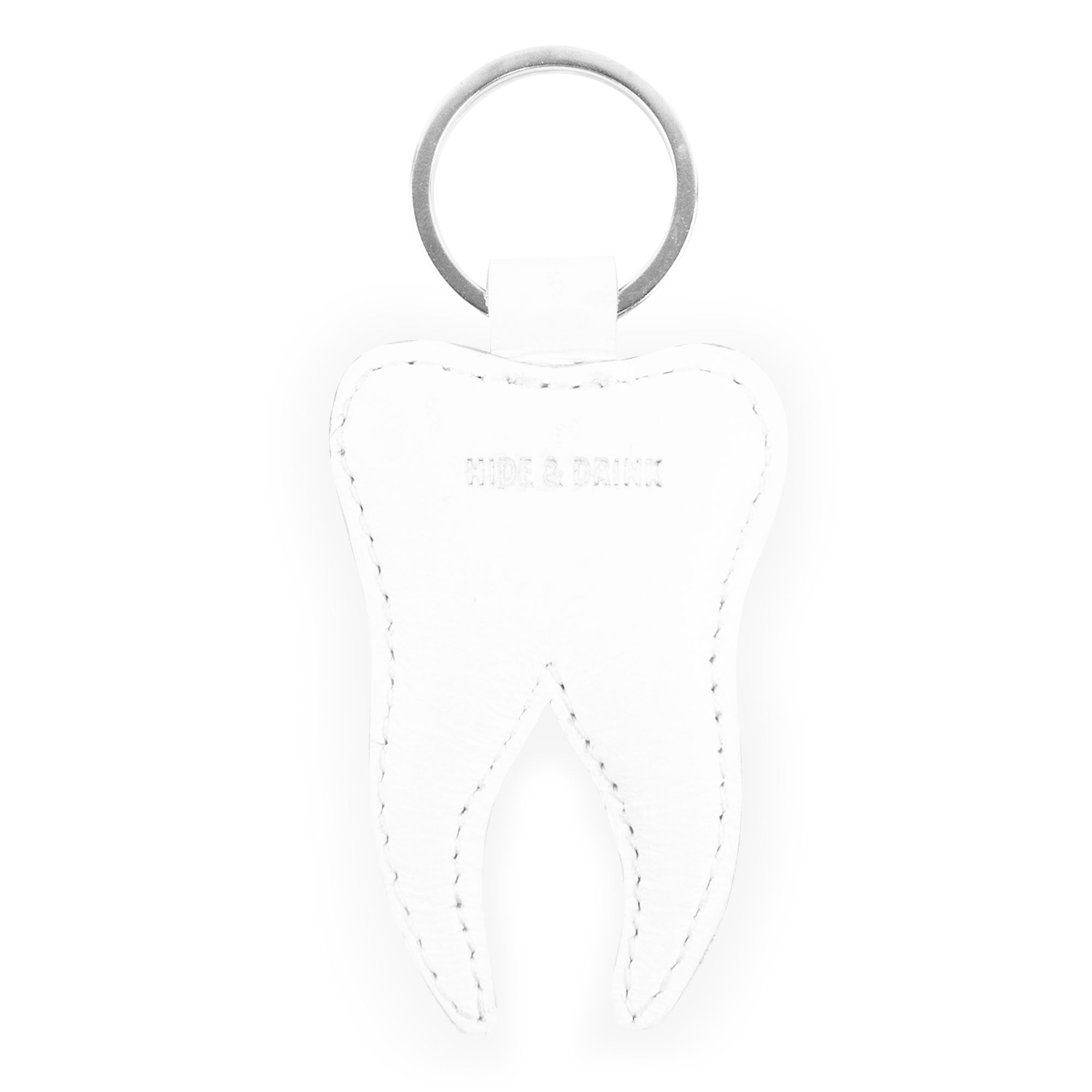 Front view of the Tooth Keychain by Hide & Drink, a delightful addition to keys for dental professionals. Constructed from full grain leather, this Tooth Leather Keychain is a charming key ring that embodies the ethos of small batch production, hand cut, hand sewn, and fire branded craftsmanship, proudly made in La Antigua Guatemala & Oaxaca Mexico.