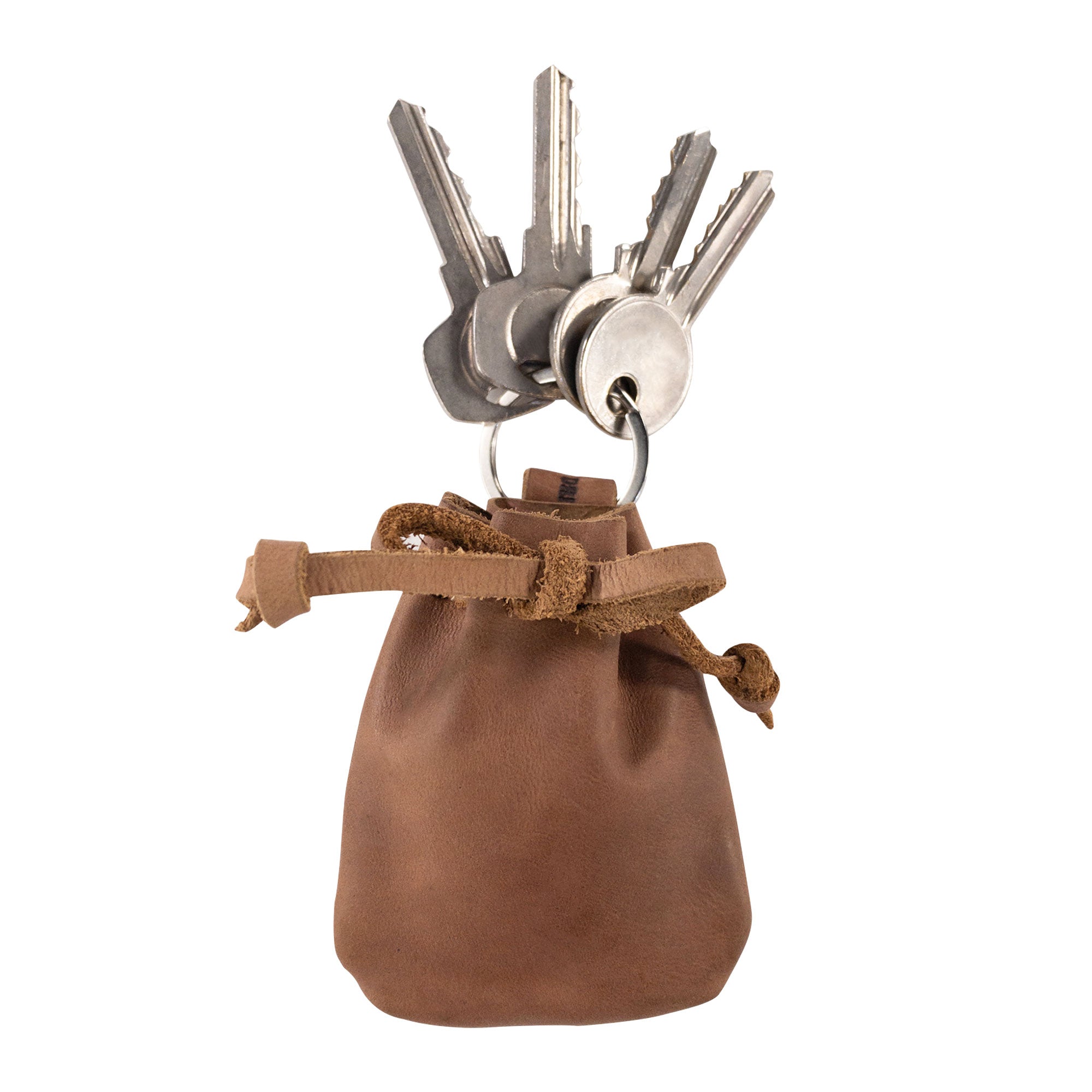 A Mini Medieval Pouch Keychain by Hide & Drink showcasing brown leather, ideal for carrying keys. This tiny bag with keyring is made from full grain leather, encapsulating the essence of a coin organizer with artisan craftsmanship from La Antigua Guatemala.