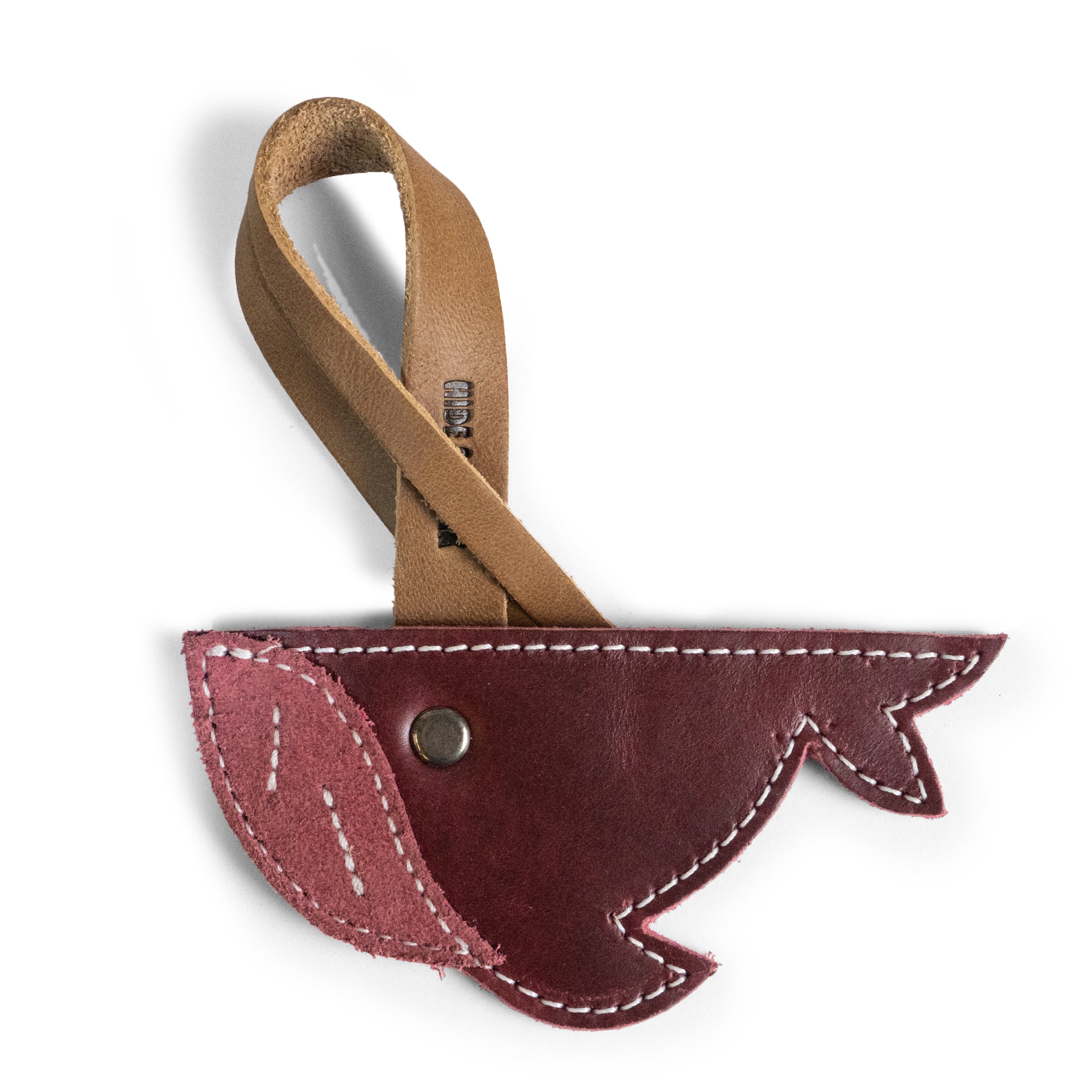 Close-up of the Whale Bag Charm by Hide & Drink, a unique accessory perfect for handbags and totes. This Whale Bag Charm for Handbags is crafted from full grain leather, showcasing artisan handmade quality. It’s an ideal Purse Charm for Tote & Backpacks, designed to be an ornament for women who appreciate stylish, durable accents. The charm is fire branded and created through small batch production in La Antigua Guatemala & Oaxaca Mexico.