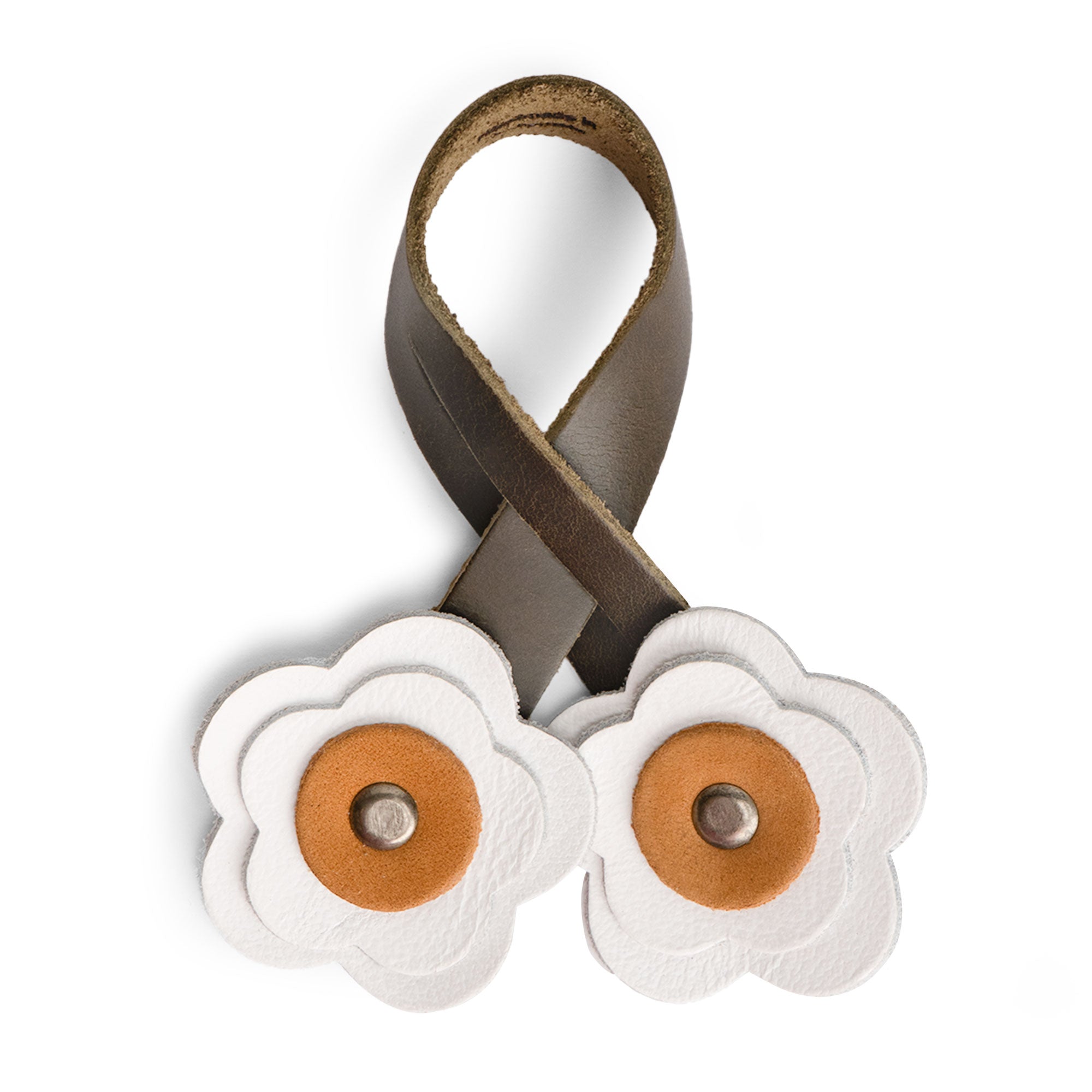 Showcasing the white Rose Bag Ornament by Hide & Drink, made of Full Grain Leather with a flower shape design. This accessory is a perfect cute charm for any bag or tote, handmade with care.