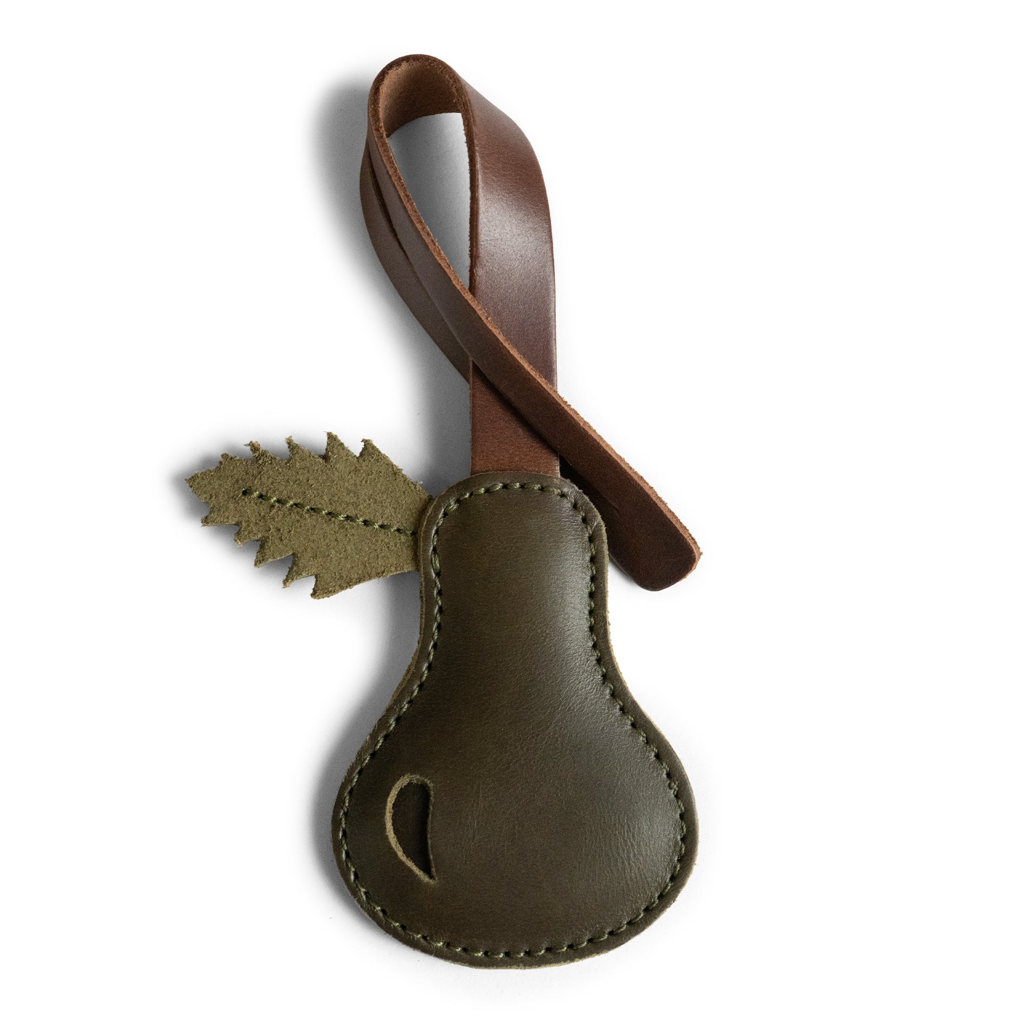 Handcrafted Pear Bag Charm by Hide & Drink, made from full grain leather, perfect for handbags, featuring a leaf design. This artisan accessory is ideal as an ornament for women and showcases small batch production craftsmanship. Handmade in La Antigua Guatemala & Oaxaca Mexico.