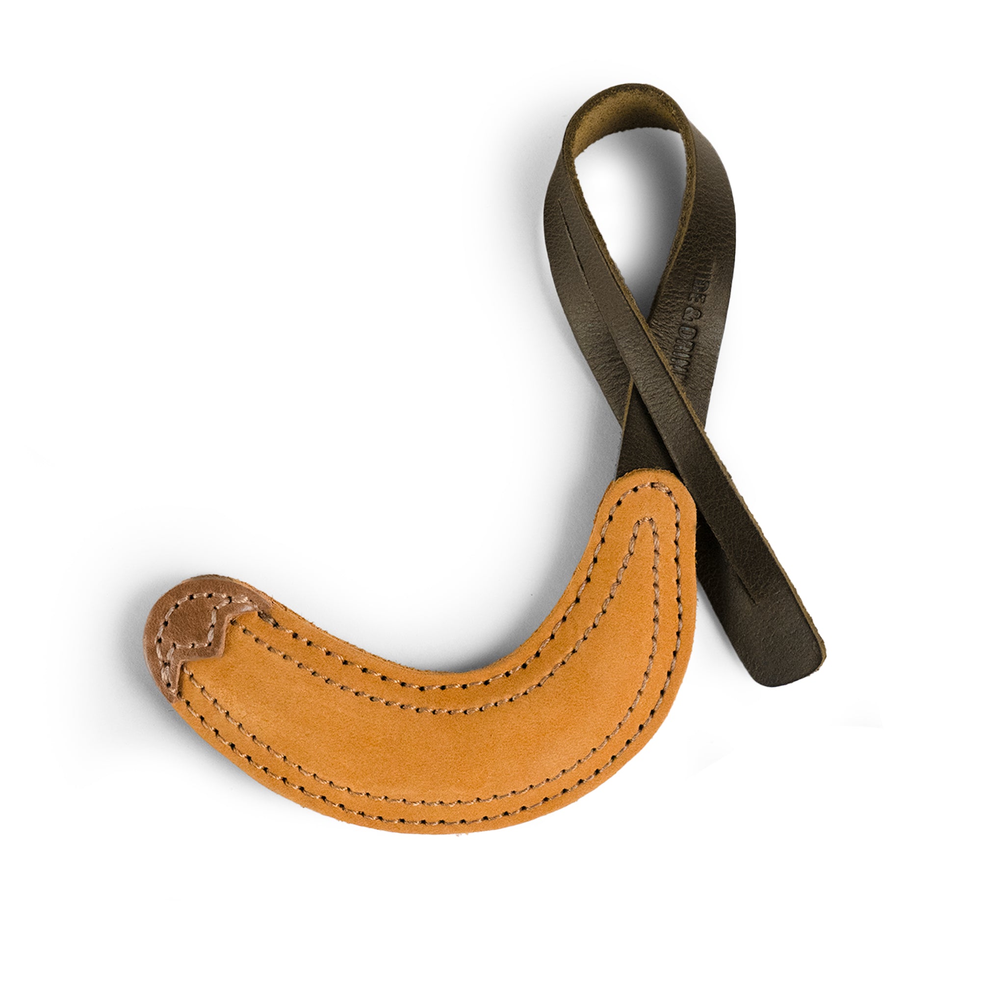 Hide & Drink Banana Bag Charm showcasing its unique design and craftsmanship. This full grain leather charm is perfect for handbags, purse charm for totes and backpacks, and is an ornament for women. Each charm is handmade in La Antigua Guatemala and Oaxaca Mexico, featuring small batch production, hand cut, hand sewn details, and fire branded artistry.
