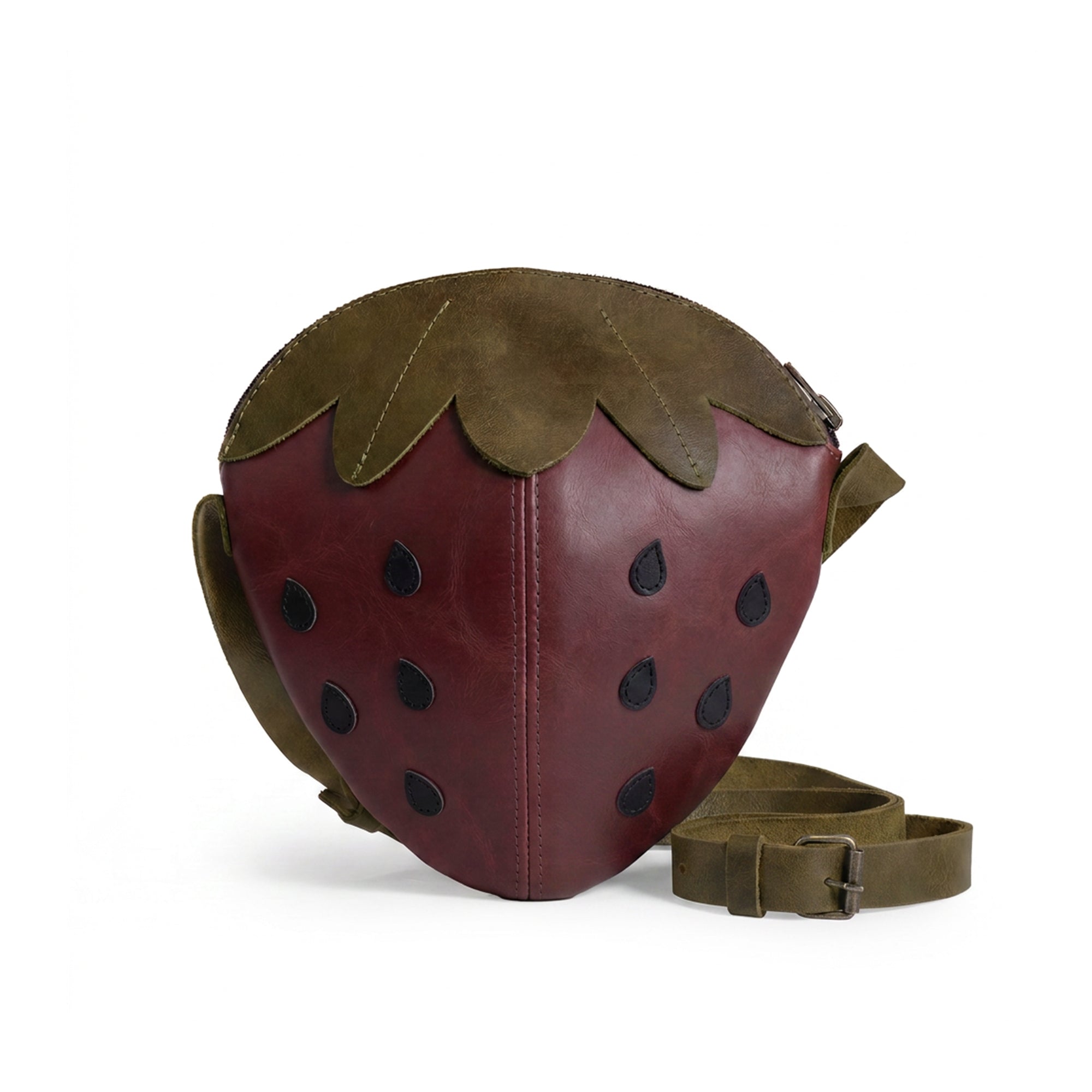 Stylish Leather Strawberry-Shaped Shoulder Bag by Tudi Frudi, featuring a unique strawberry design made from Full Grain Leather. This crossbody bag is perfect for adding a fun touch to any outfit. Handmade in La Antigua Guatemala & Oaxaca Mexico, this messenger bag exemplifies artisanal craftsmanship with small batch production, hand-cut and hand-sewn details.