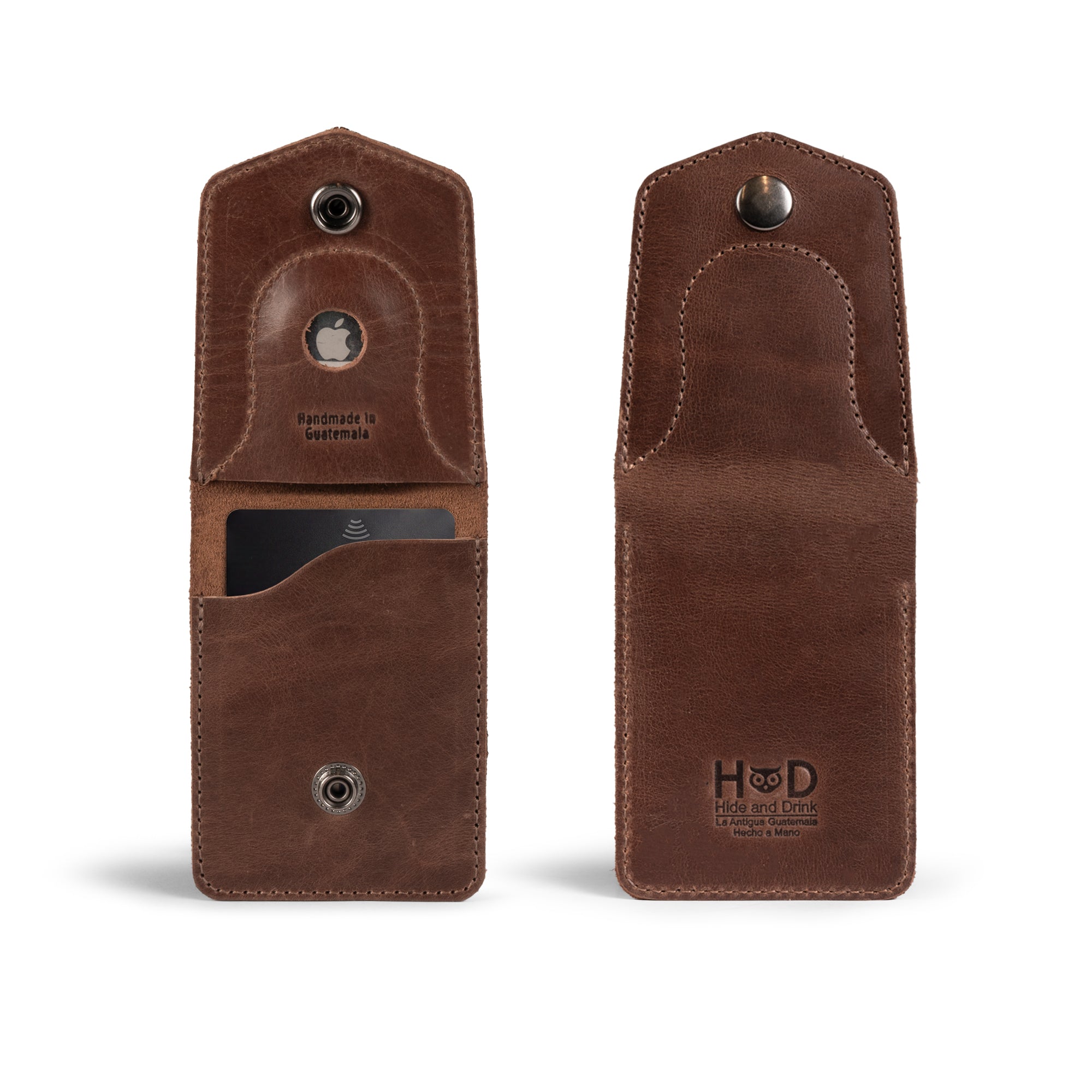 The Card Holder with AirTag Slot by Hide & Drink features a vintage design, showcasing a full grain leather exterior and a convenient GPS slot. This compact pocket organizer for men offers ample storage for cash and cards while emphasizing artisan craftsmanship, handmade in La Antigua Guatemala and Oaxaca Mexico.