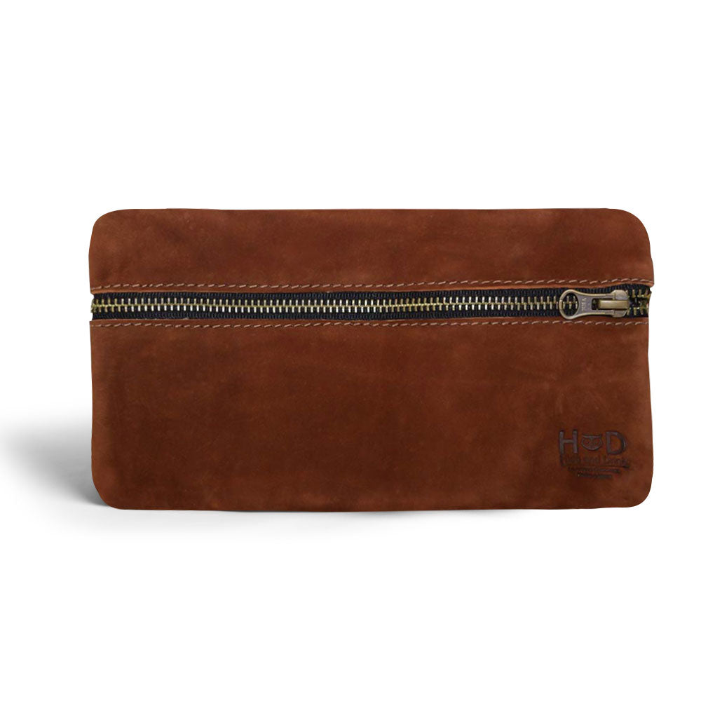 Hide & Drink Utility Cord Pouch crafted in a luxurious dark leather, perfect for storing tech accessories. This handmade zippered bag functions as an all-purpose utility & charger case for MacBook, iPad & Laptop, combining style and function as a travel cable organizer, made in La Antigua Guatemala & Oaxaca Mexico.
