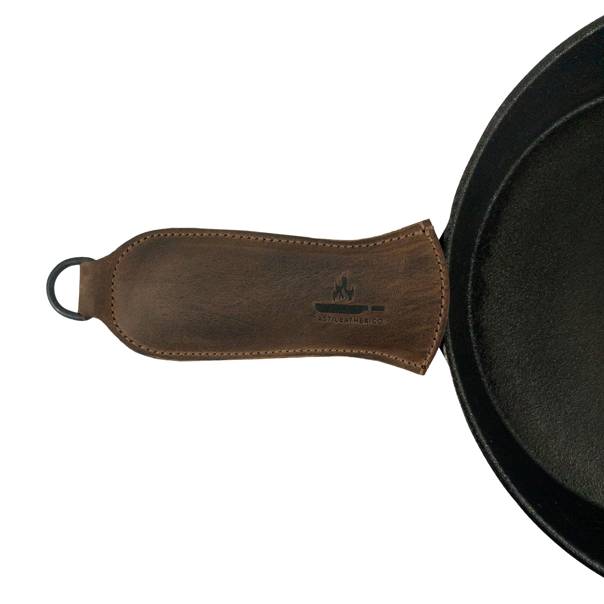 Hanging Pan Handle Cover by Cast Leather Co., featuring a comfortable Hot Handle Panhandle with Half Ring that offers a secure grip. This full grain leather accessory ensures your cookware slides on/off easily onto metal skillet grips, embodying the artisan craftsmanship of small batch production from La Antigua Guatemala & Oaxaca Mexico.