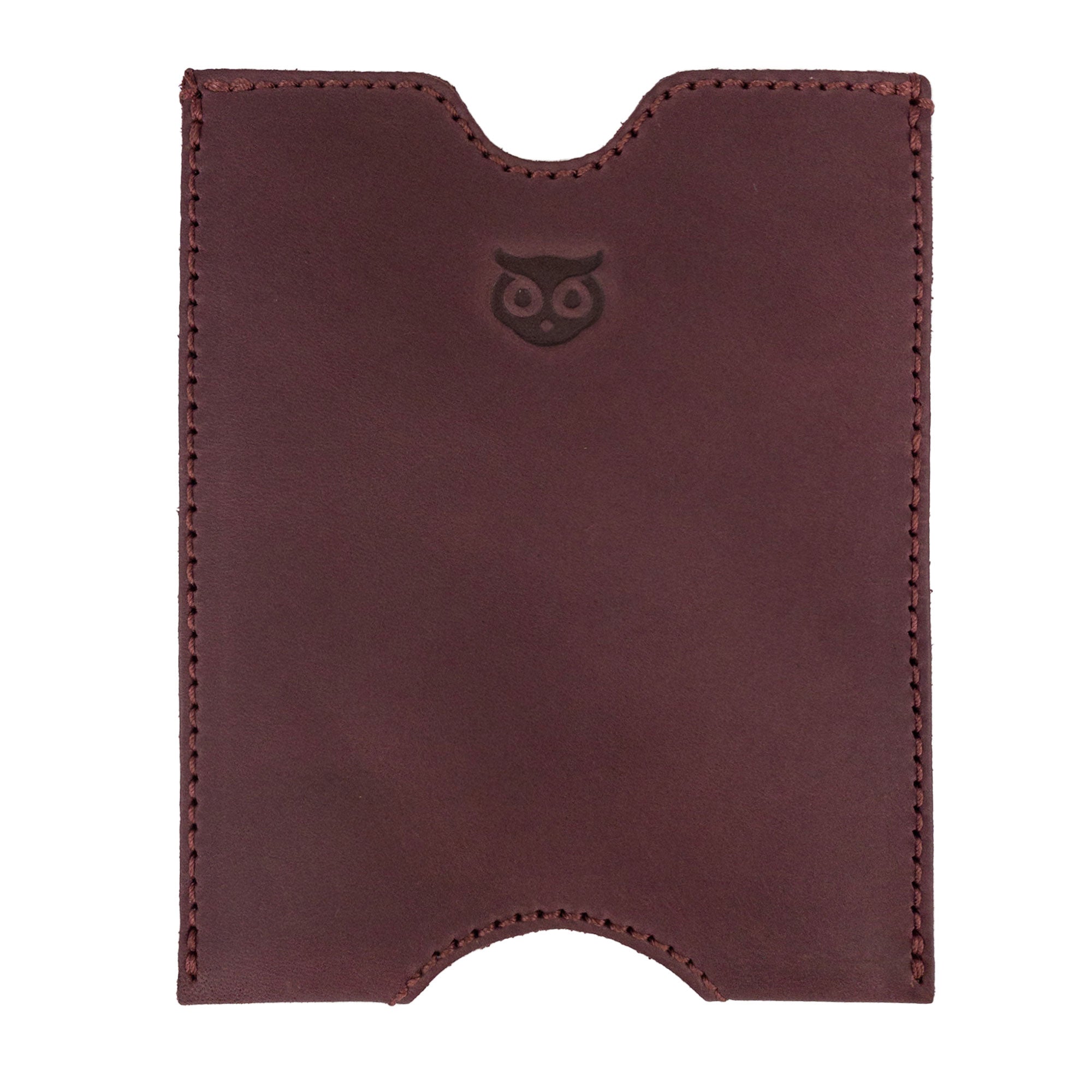 Front view of the burgundy Hide & Drink Passport Sleeve featuring the owl logo, made from Full Grain Leather, presenting a beautiful Travel Passport Pocket Sleeve. This artisan-crafted product is handmade in La Antigua Guatemala & Oaxaca Mexico, reflecting small batch production with hand cut and hand sewn quality.