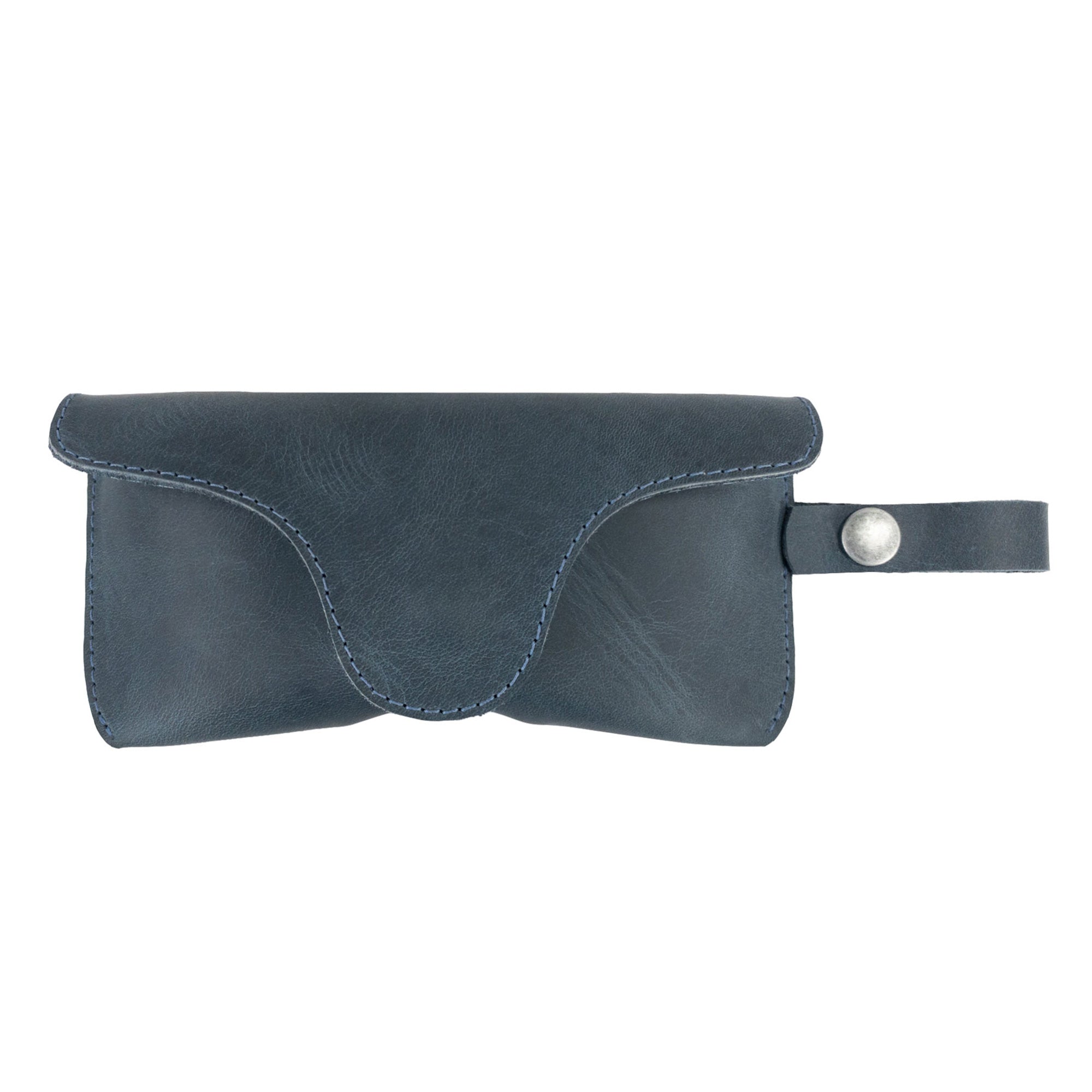 Dark Blue Eyeglasses Case with Strap by Hide & Drink featuring a trendy design. Crafted from durable full grain leather, this sunglasses case acts as a dependable protector for eyewear, highlighting handmade quality from La Antigua Guatemala & Oaxaca Mexico.
