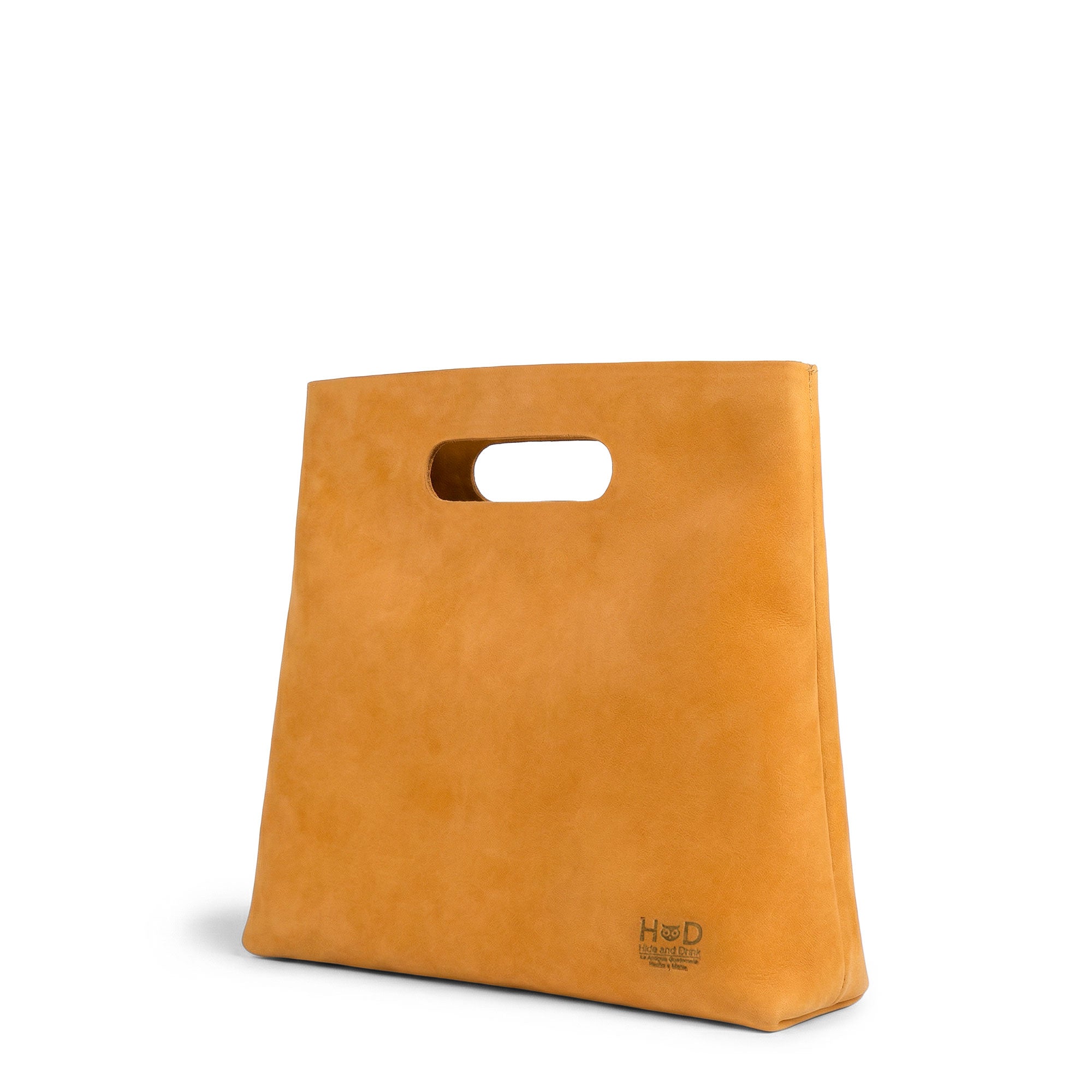 Side profile of the Minimalist Boho Handbag by Hide & Drink, demonstrating its sleek silhouette and craftsmanship. This Minimalist Handbag for Women is perfect as a Tote Bag or Shopping Bag, made from premium Full Grain Leather, showcasing artisan skills through hand cut and hand sewn methods in La Antigua Guatemala & Oaxaca Mexico.