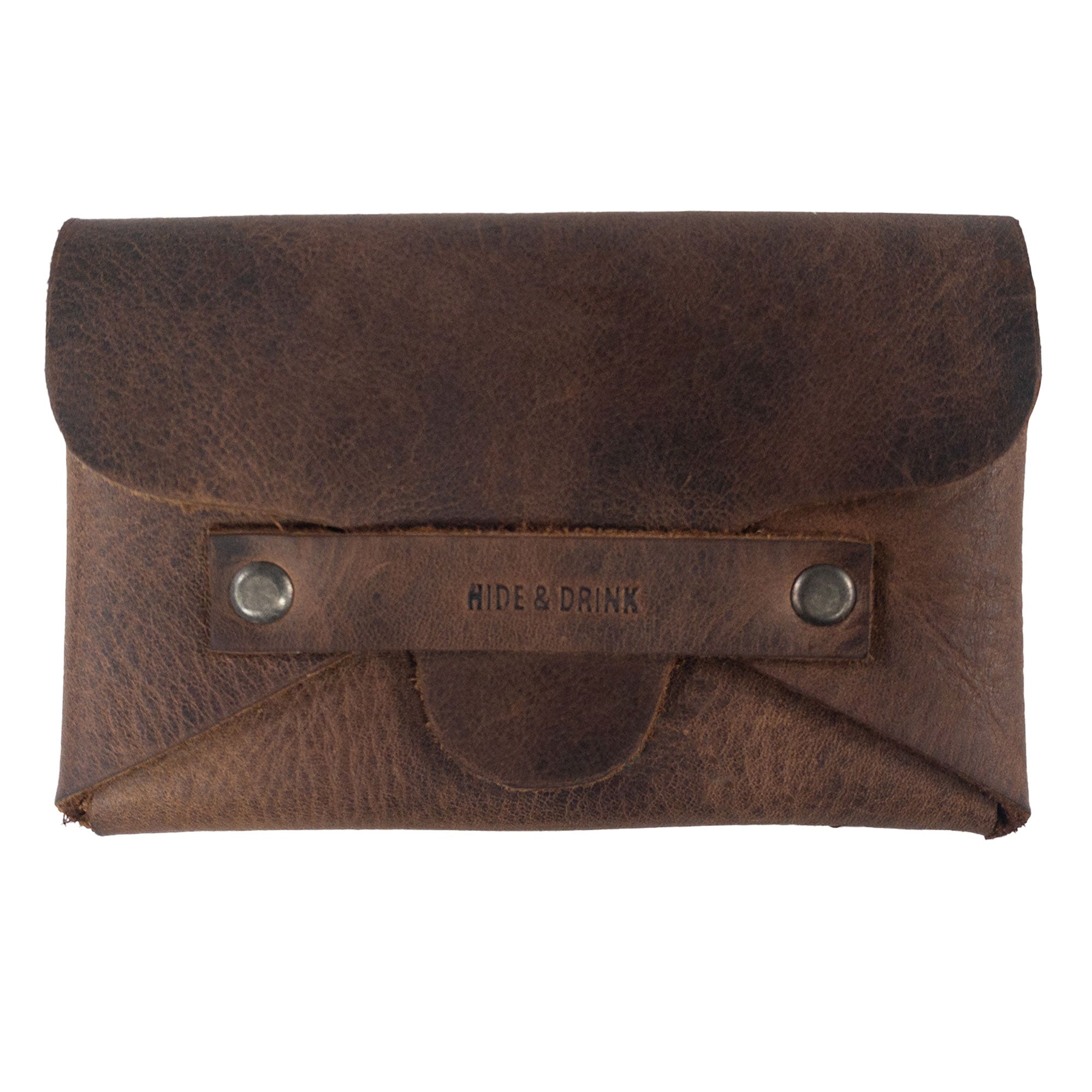 Hide & Drink's Snapless Business Card Holder displayed closed, exemplifying a sleek vintage wallet design. This sturdy pouch for men and women is made from Full Grain Leather, serving as a reliable money organizer. Each wallet is crafted through small batch production, ensuring detailed hand cut and hand sewn quality, proudly made in La Antigua Guatemala and Oaxaca Mexico.