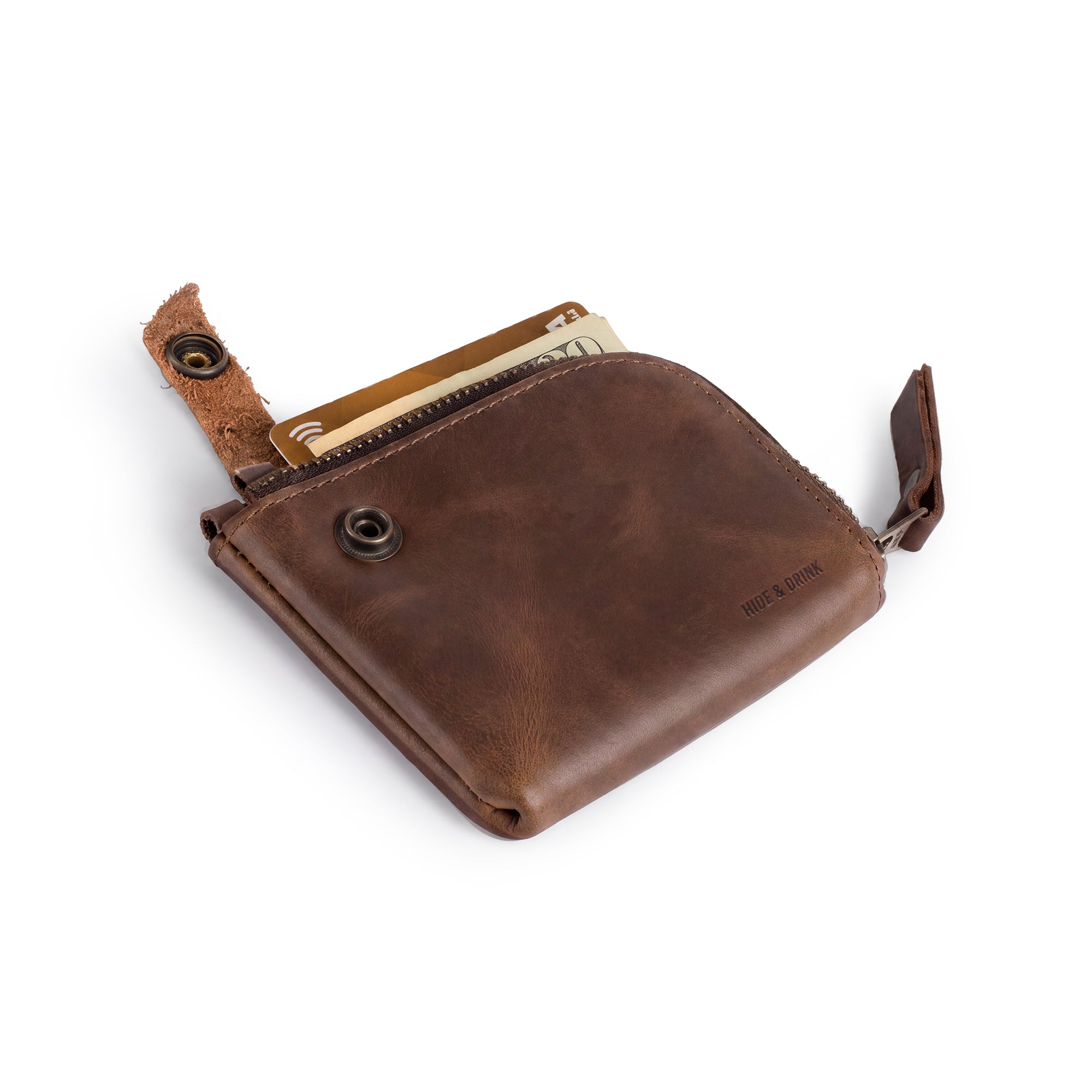 Lion's Mane Zippered Wallet by Hide & Drink, a compact zippered wallet made of full grain leather, ideal for storing cards and cash. Perfect travel essentials and a stylish mini pouch organizer, crafted with attention to detail in La Antigua Guatemala.