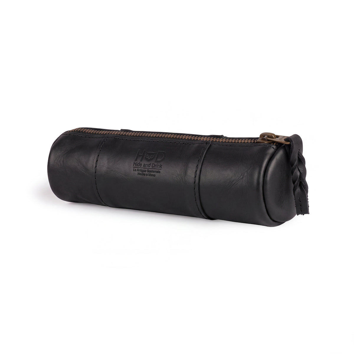 Utility Cylinder Case by Hide & Drink showcasing a sleek black leather finish. This handmade, artisan bag is designed for organizing personal items and office supplies, crafted from durable Full Grain Leather. Cylinder Case, Classic Bag, Rustic.