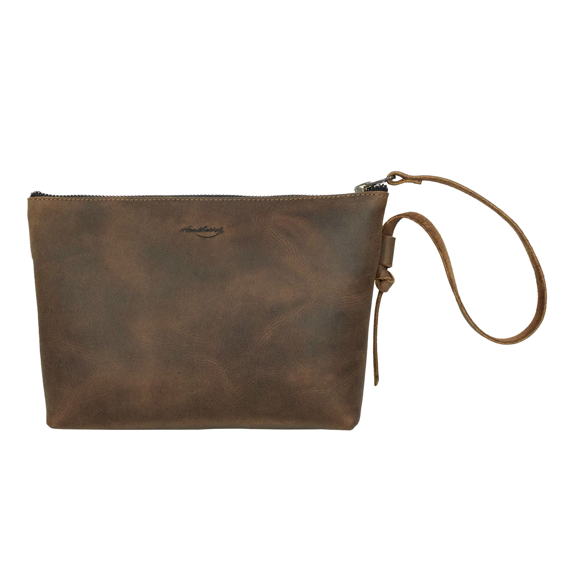 Heather's Clutch Bag with Strap made of Full Grain Leather, perfect for storing essentials. This stylish wrist wallet for cards and money also works great for makeup, cosmetics, and toiletry items. Artisan handmade in La Antigua Guatemala & Oaxaca Mexico, showcasing small batch production, hand cut, and hand sewn craftsmanship.