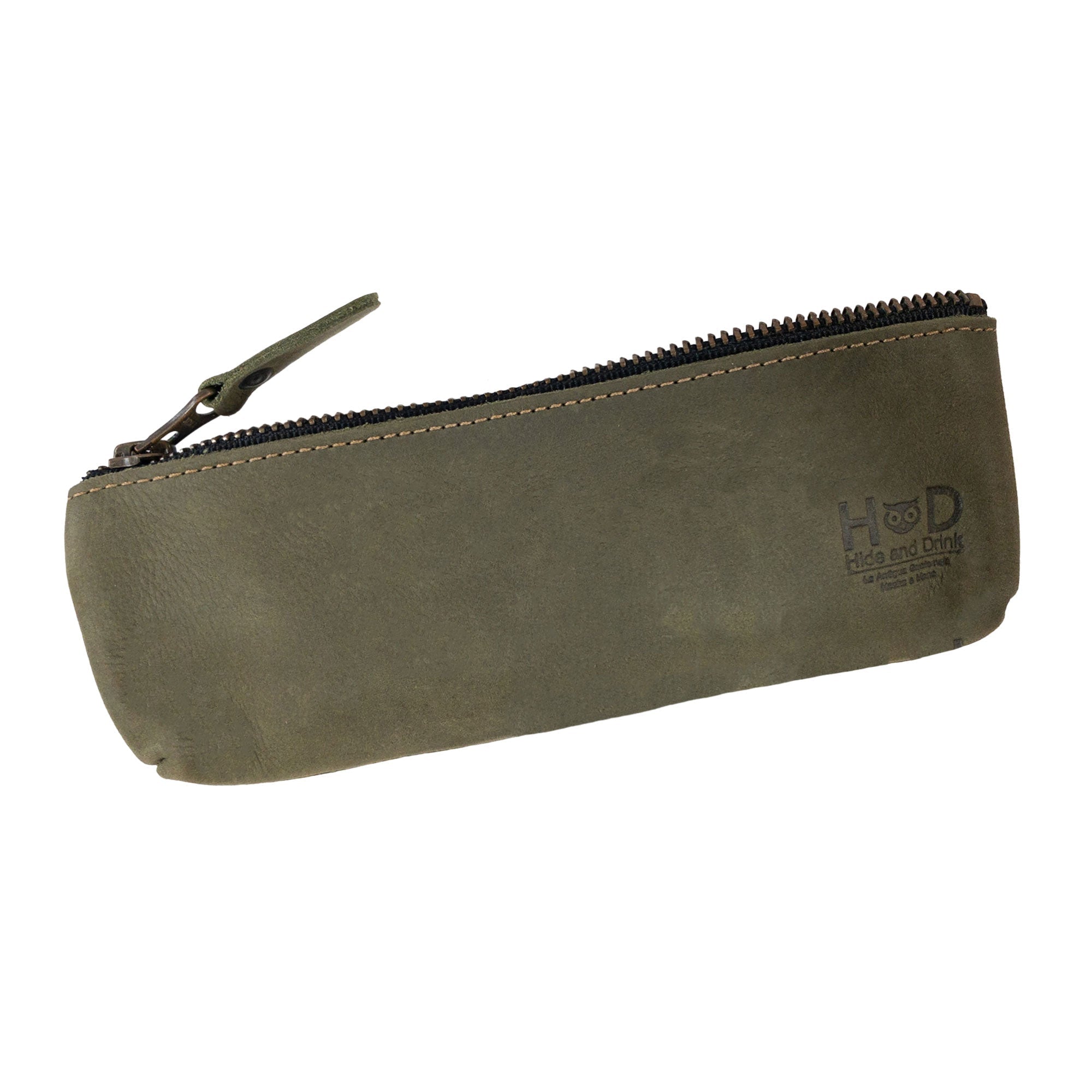 Hide & Drink Pencil Pouch alongside pens and a notebook, illustrating its practical use as a pen and marker pouch. Made with durable full grain leather, this flat zippered holder embodies classic style for artists and is lovingly handcrafted in La Antigua Guatemala & Oaxaca Mexico.