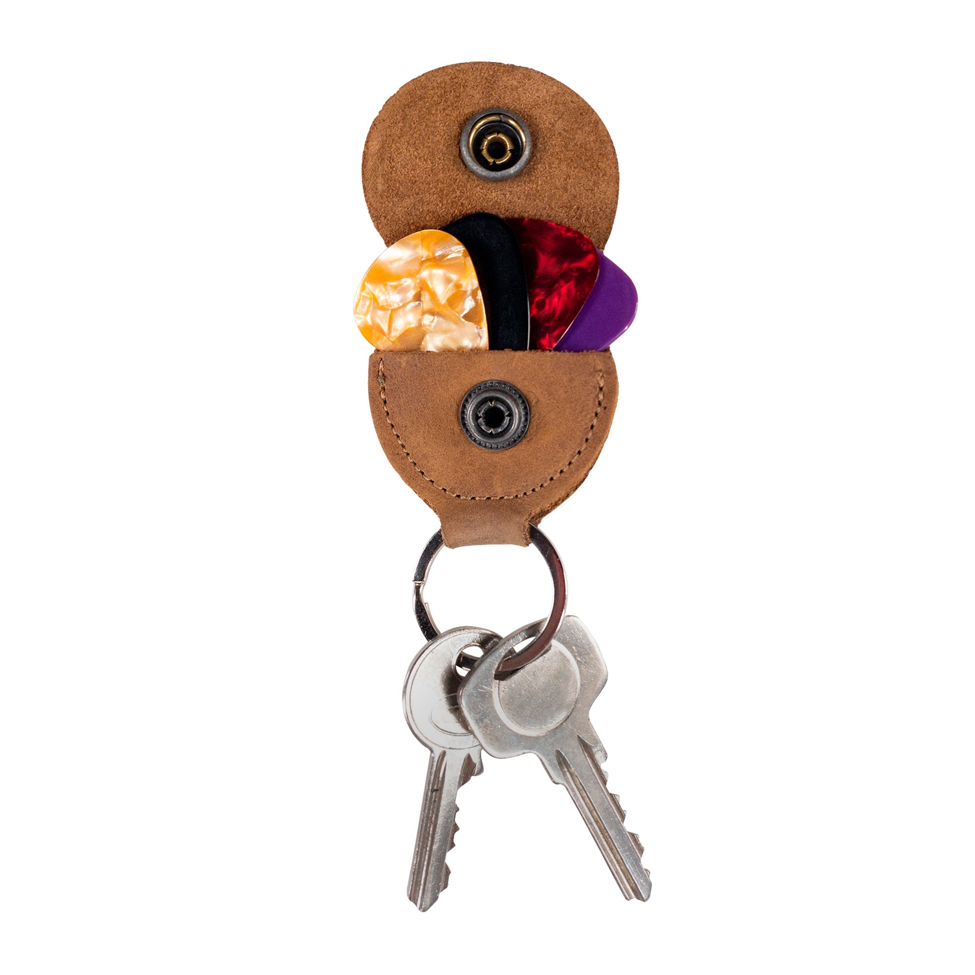The Key Chain & Guitar Pick Holder from Hide & Drink is showcased here with colorful guitar picks inside, emphasizing its functionality. This Guitar Pick Holder with Ring doubles as a stylish key organizer for guitarists. Crafted using Full Grain Leather, this piece aligns with StockyardX's focus on small batch production. Each item is hand cut, hand sewn, and fire branded, assuring artisan quality made in La Antigua Guatemala & Oaxaca Mexico.