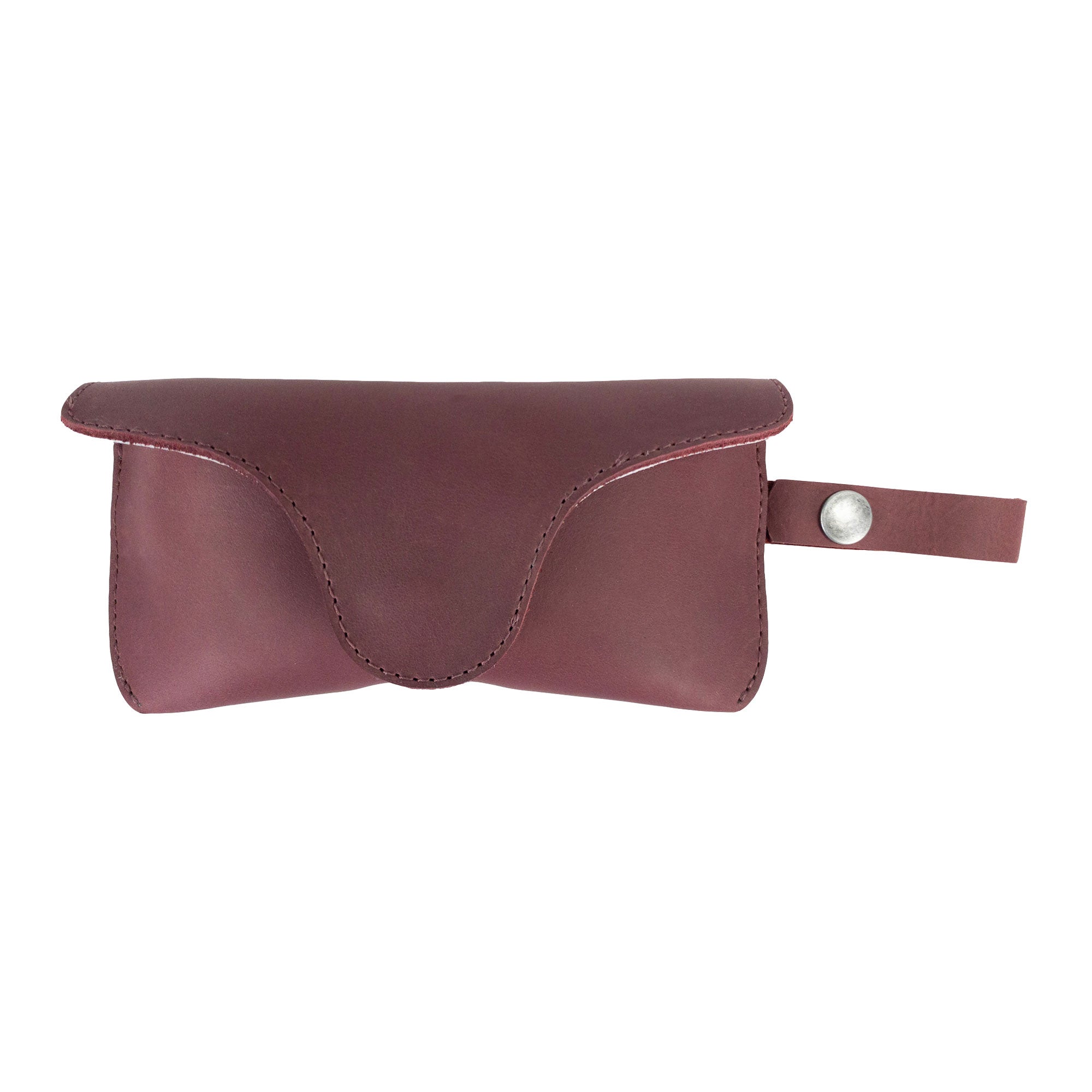 Rich Burgundy Eyeglasses Case with Strap by Hide & Drink, designed for stylish functionality. Crafted from full grain leather, this sunglasses case is a reliable protector for eyewear, symbolizing artisan craftsmanship in La Antigua Guatemala & Oaxaca Mexico.