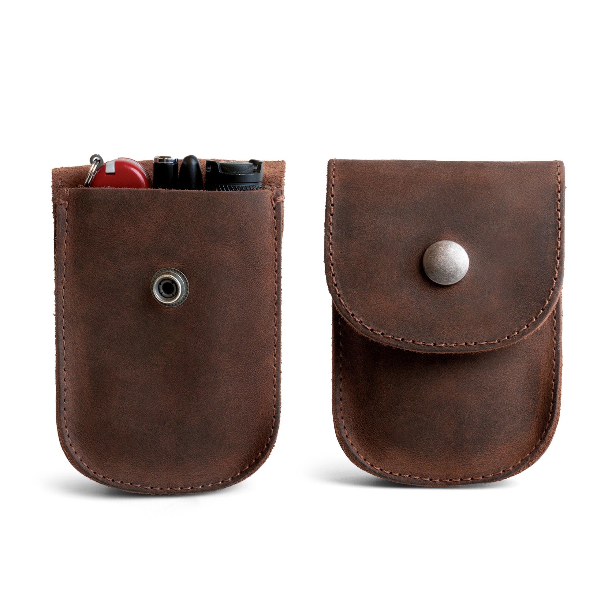 Front view of the Curvy Waist Bag by Heather's, showcasing a stylish holster pouch design. This durable waist bag is perfect for holding coins, change, headphones, and other personal items. Conveniently attaches to your belt and crafted from full grain leather, it exemplifies small batch production, being hand cut and hand sewn. Proudly fire branded, this artisan bag is handmade in La Antigua Guatemala & Oaxaca Mexico.
