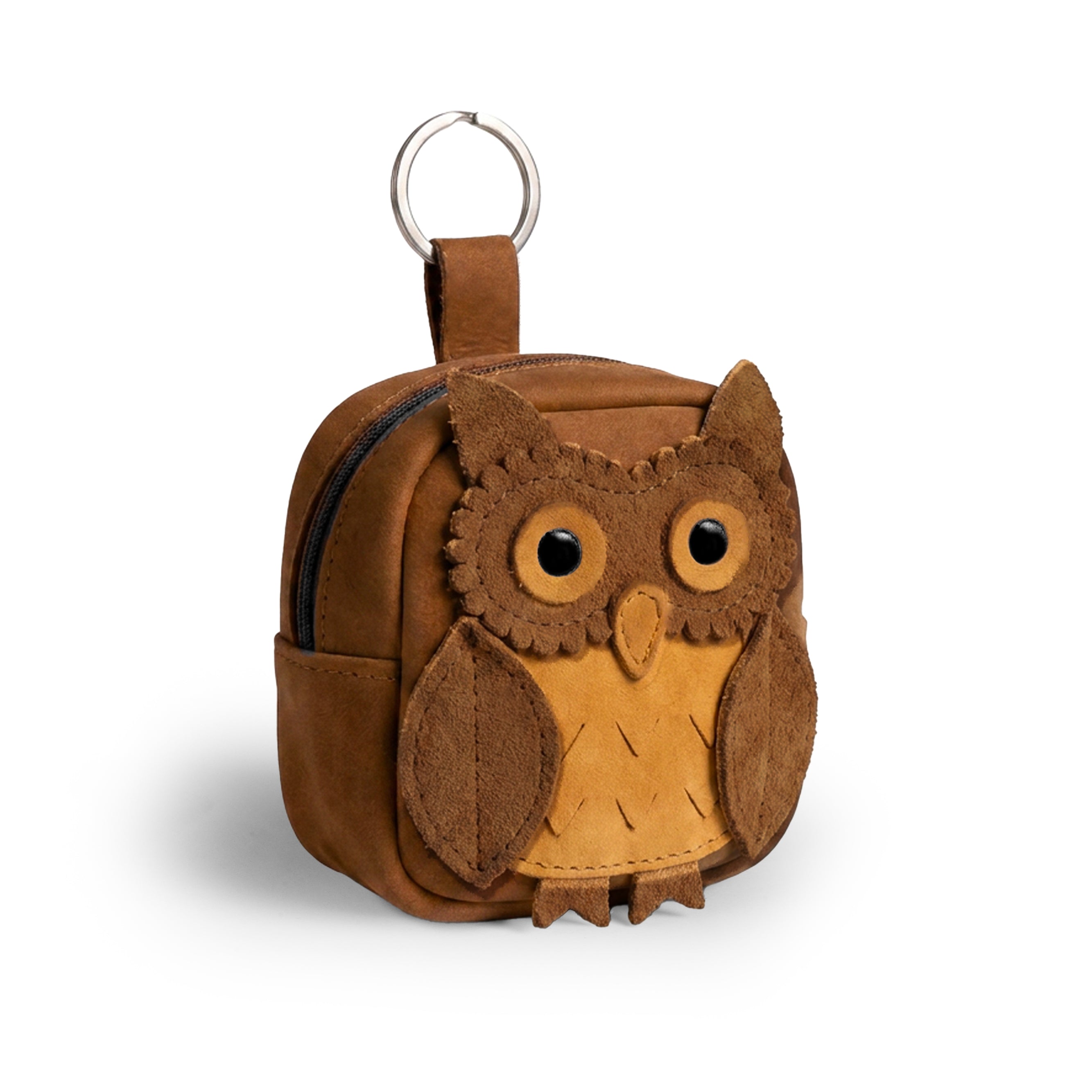 Owl Mini Backpack by Hide & Drink, featuring a charming owl design, is perfect as an Owl Mini Backpack Coin Purse or Cute Keychain. This owl-shaped case for cables, coins, and small items is crafted from Full Grain Leather, showcasing small batch production. Each piece is hand cut, hand sewn, fire branded, and proudly made by artisans in La Antigua Guatemala & Oaxaca Mexico.
