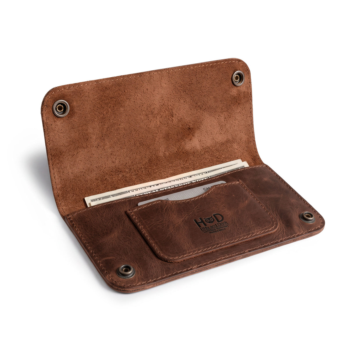 Open view of the Brown Double Snap Folio Wallet by Hide & Drink, revealing its practical design for holding cash and cards. This full grain leather wallet acts as a rectangular flat bill holder with card slot, an ideal night bag and travel accessory. Hand crafted in La Antigua Guatemala & Oaxaca Mexico, showcasing the dedication of small batch production.