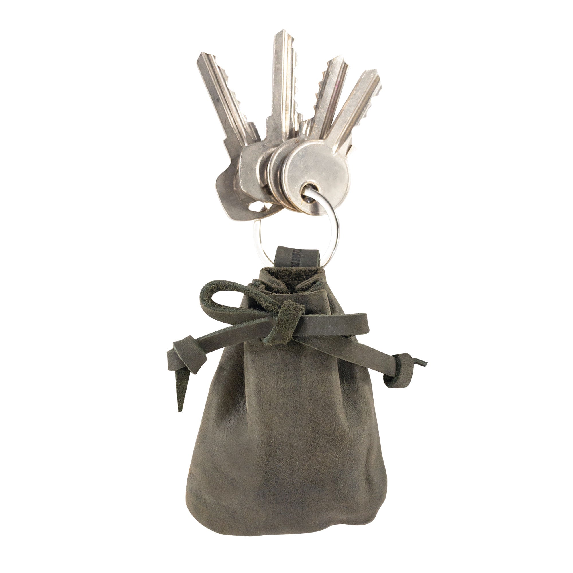 A Mini Medieval Pouch Keychain by Hide & Drink showcasing its stylish design in deep green leather. This tiny bag with keyring effectively acts as a coin pouch and highlights premium craftsmanship from La Antigua Guatemala.