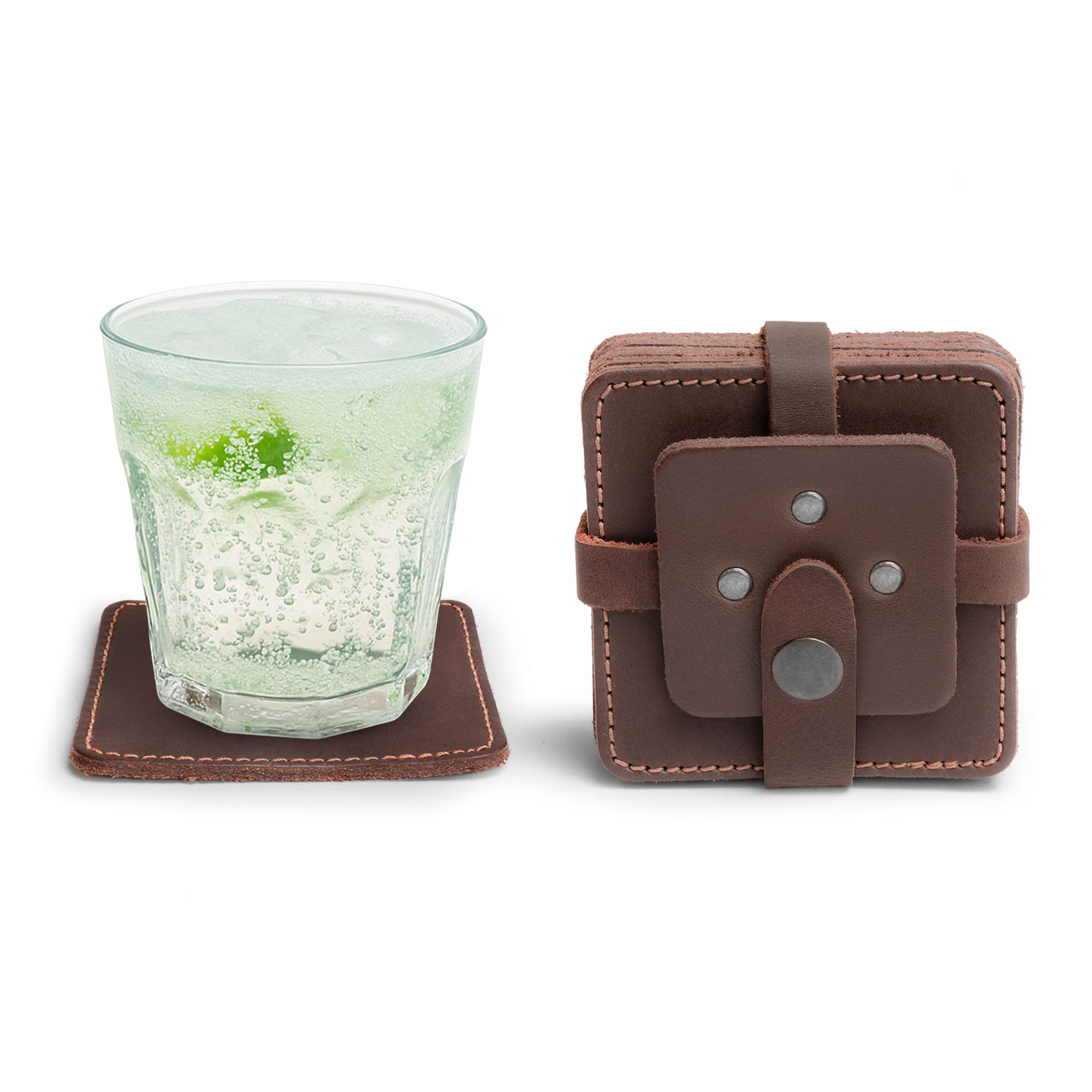 Vintage Squared Coaster (8 pack) by Hide & Drink featuring a rustic coaster set with a glass and a protective case. Perfect as coasters set of 8, ideal for table protection for drinks and an elegant accessory for home/office decor. Made of premium full grain leather in small batch production, this artisan product is hand cut, hand sewn, and fire branded, showcasing craftsmanship from La Antigua Guatemala & Oaxaca Mexico.