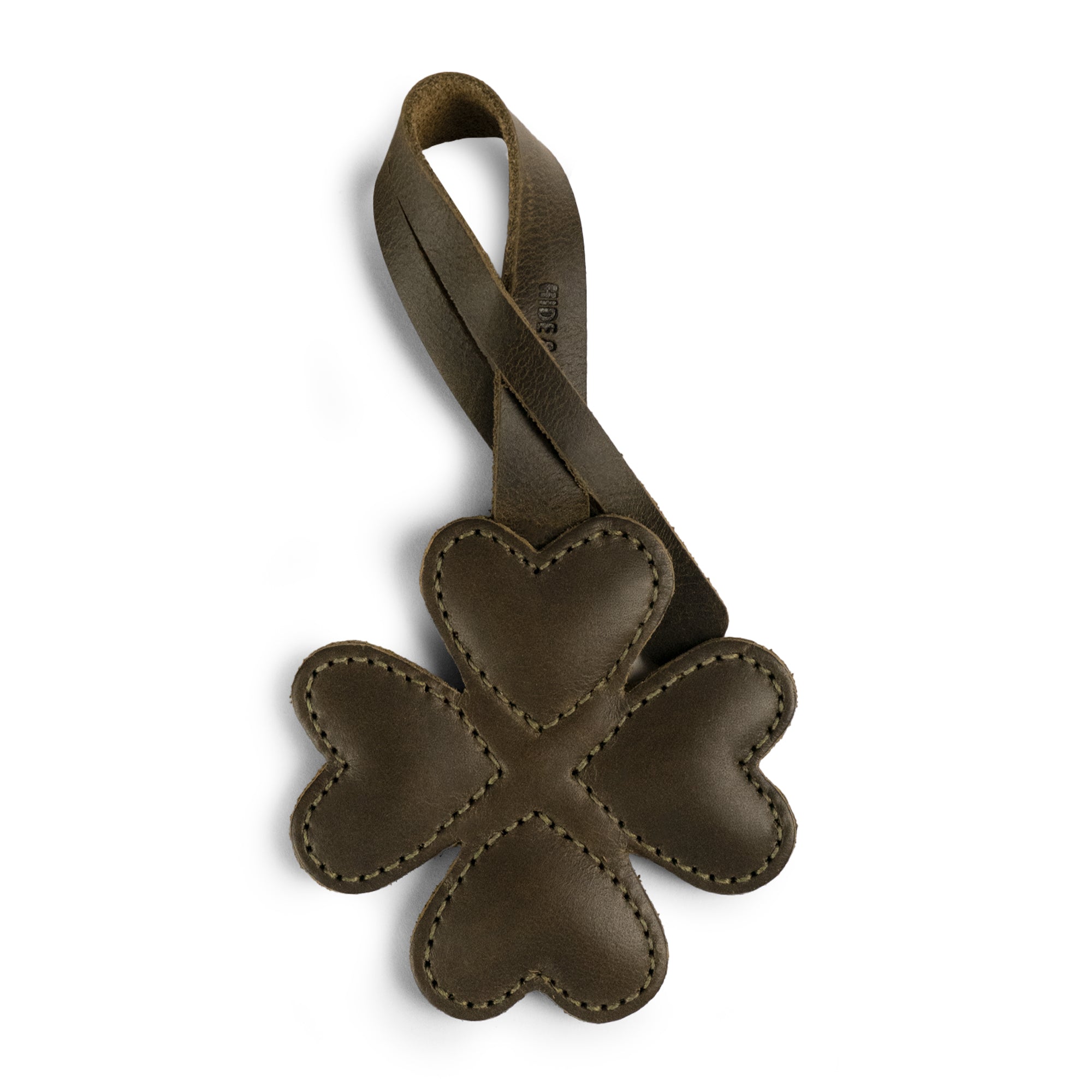 Hide & Drink Clover Bag Charm, a handmade four-leaf clover design in full grain leather. Perfect as a purse charm for tote bags and backpacks, this artisan accessory from La Antigua Guatemala & Oaxaca Mexico showcases small batch production with hand cut, hand sewn, and fire branded details. Ideal ornament for women.