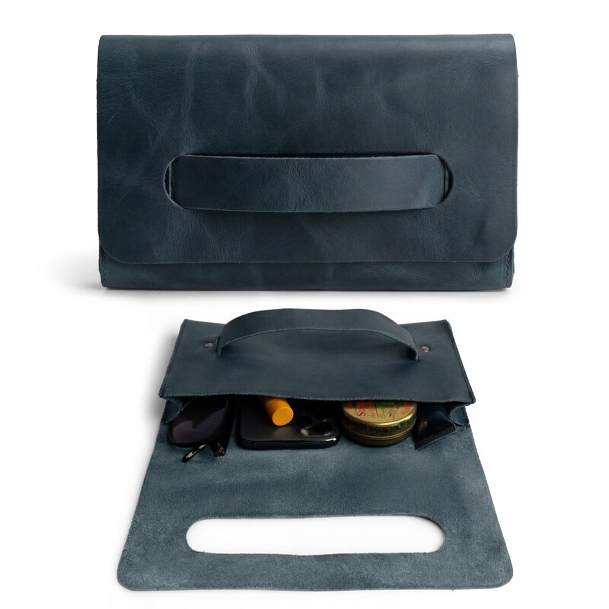 Interior view of the navy Clutch Bag With Handle from Hide & Drink, showcasing its spacious design for essentials. This Full Grain Leather Clutch Bag with Handle is ideal for women looking for a chic handbag or night bag, lovingly handcrafted in Guatemala and Mexico.