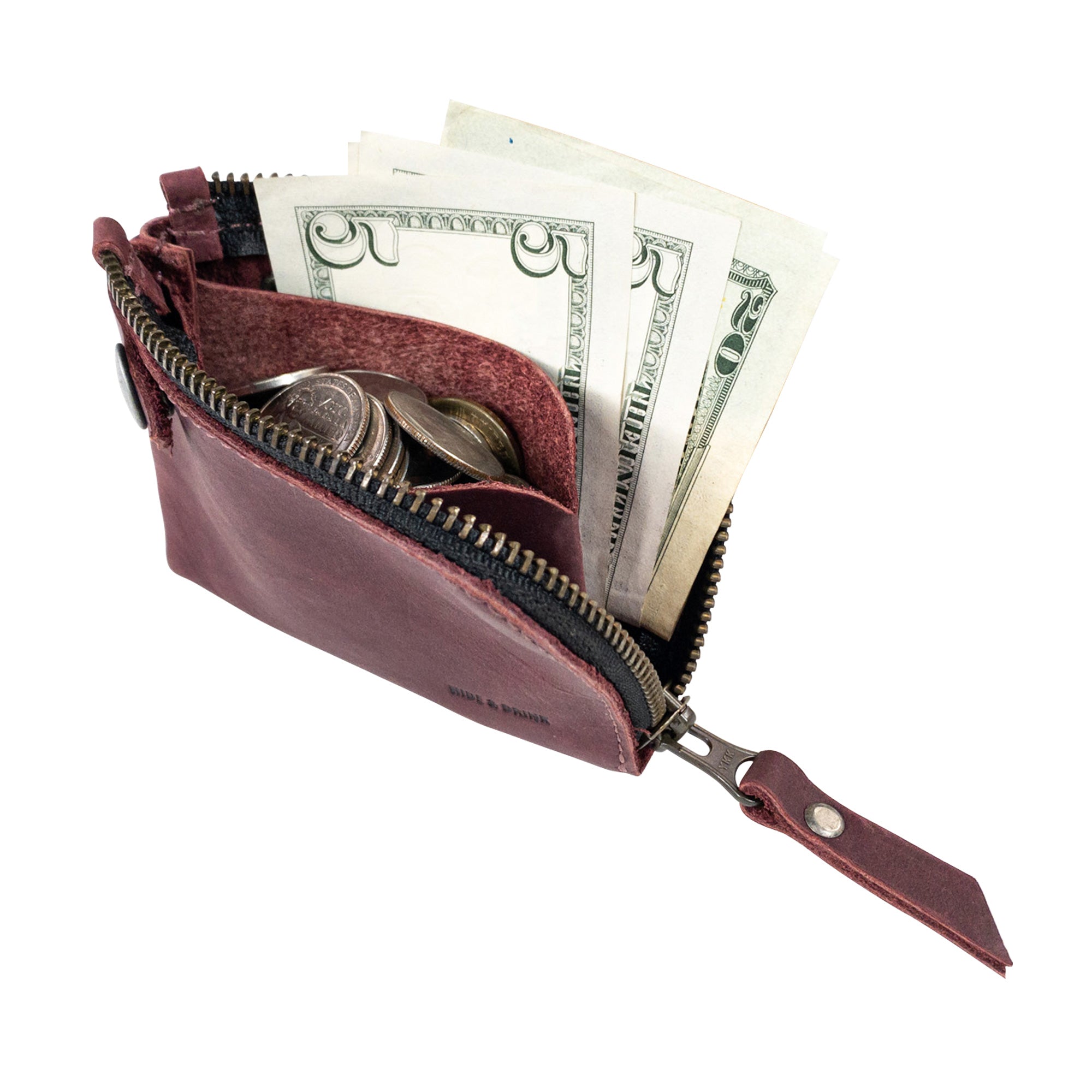 Brown Lion's Mane Zippered Wallet by Hide & Drink filled with cash, providing a sneak peek into its practical use as a cash holder.