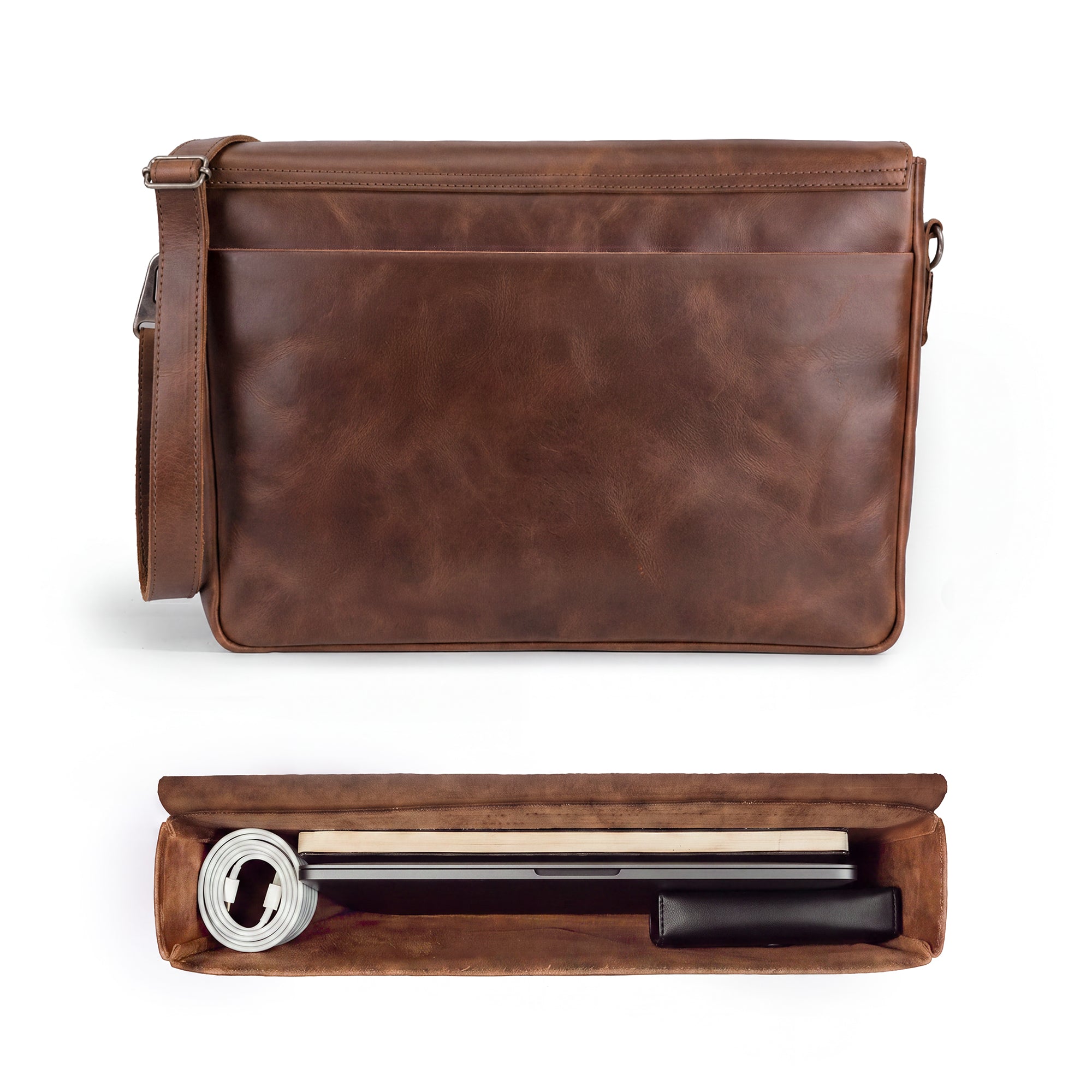 Open view of Hide & Drink's Messenger Bag with Adjustable Strap featuring an interior pocket for organization. This messenger bag with shoulder strap is made from high-quality full grain leather, ideal for travelers and artisans alike, showcasing small batch production and handmade quality. Handmade in La Antigua Guatemala & Oaxaca Mexico.