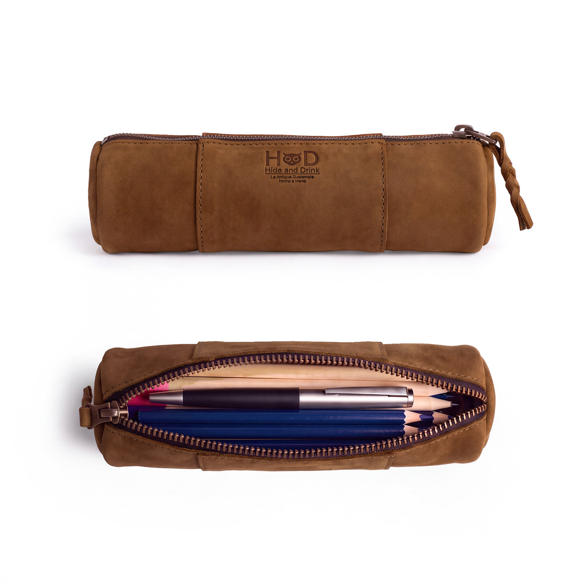 Side view of the Utility Cylinder Case by Hide & Drink highlighting the durable zipper. This elegant, handmade bag is perfect for storing personal items or office supplies, crafted from Full Grain Leather in Oaxaca Mexico. Cylinder Case, Rustic, Artisan.