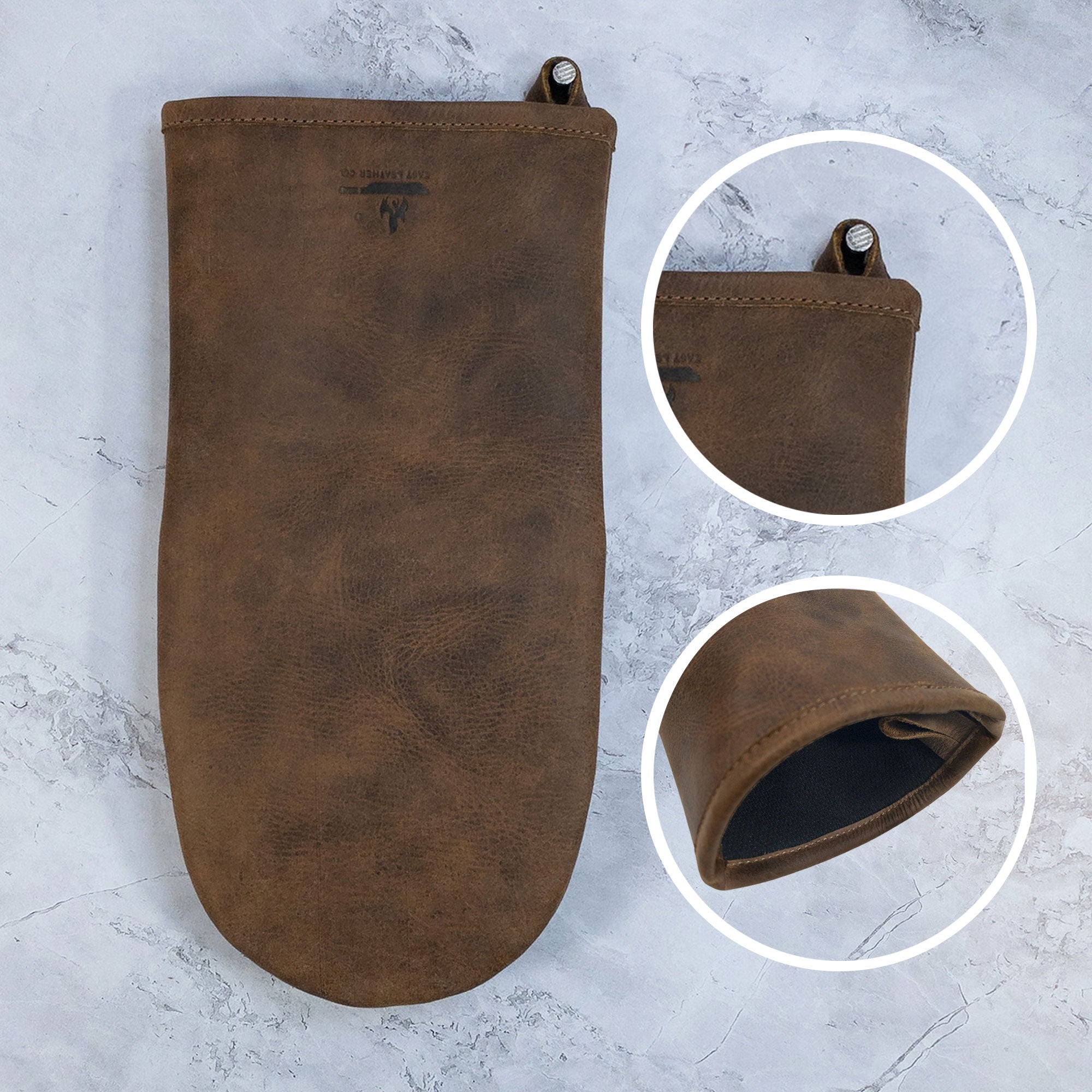 The interior view of a Cast Leather Co. Oven Mitt Heat Resistant, emphasizing quality stitching. This Single Oven Mitt Glove Heat Resistant is an ideal potholder for any kitchen, showcasing the beauty of full grain leather. StockyardX's commitment to small batch production is evident in its hand cut and hand sewn artistry, proudly handmade in La Antigua Guatemala & Oaxaca Mexico.