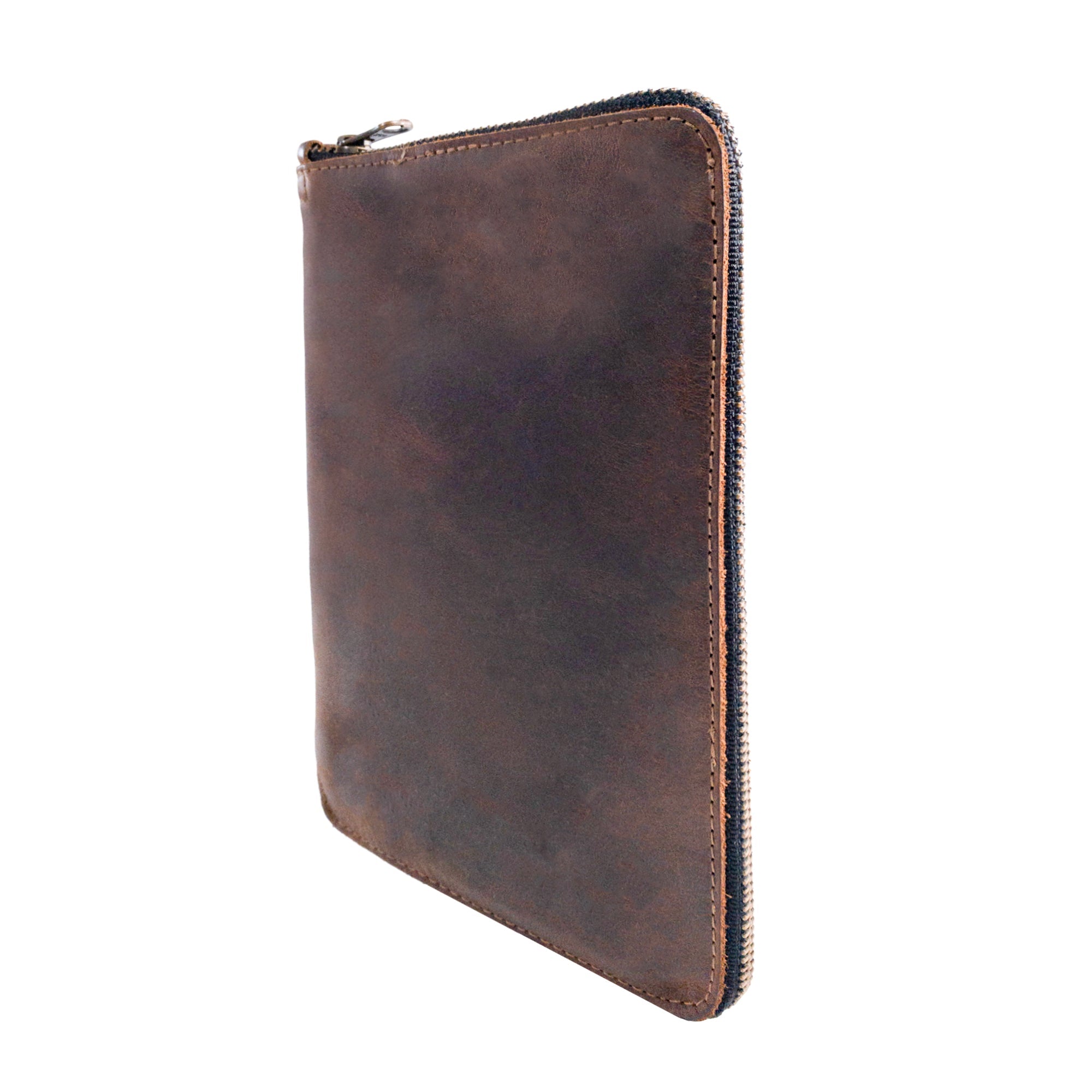 Tilted view of Hide & Drink Zippered Journal Cover for Moleskine (Notebook NOT Included), detailing its sturdy leather craftsmanship. Artisan-made in La Antigua Guatemala for functionality and style.