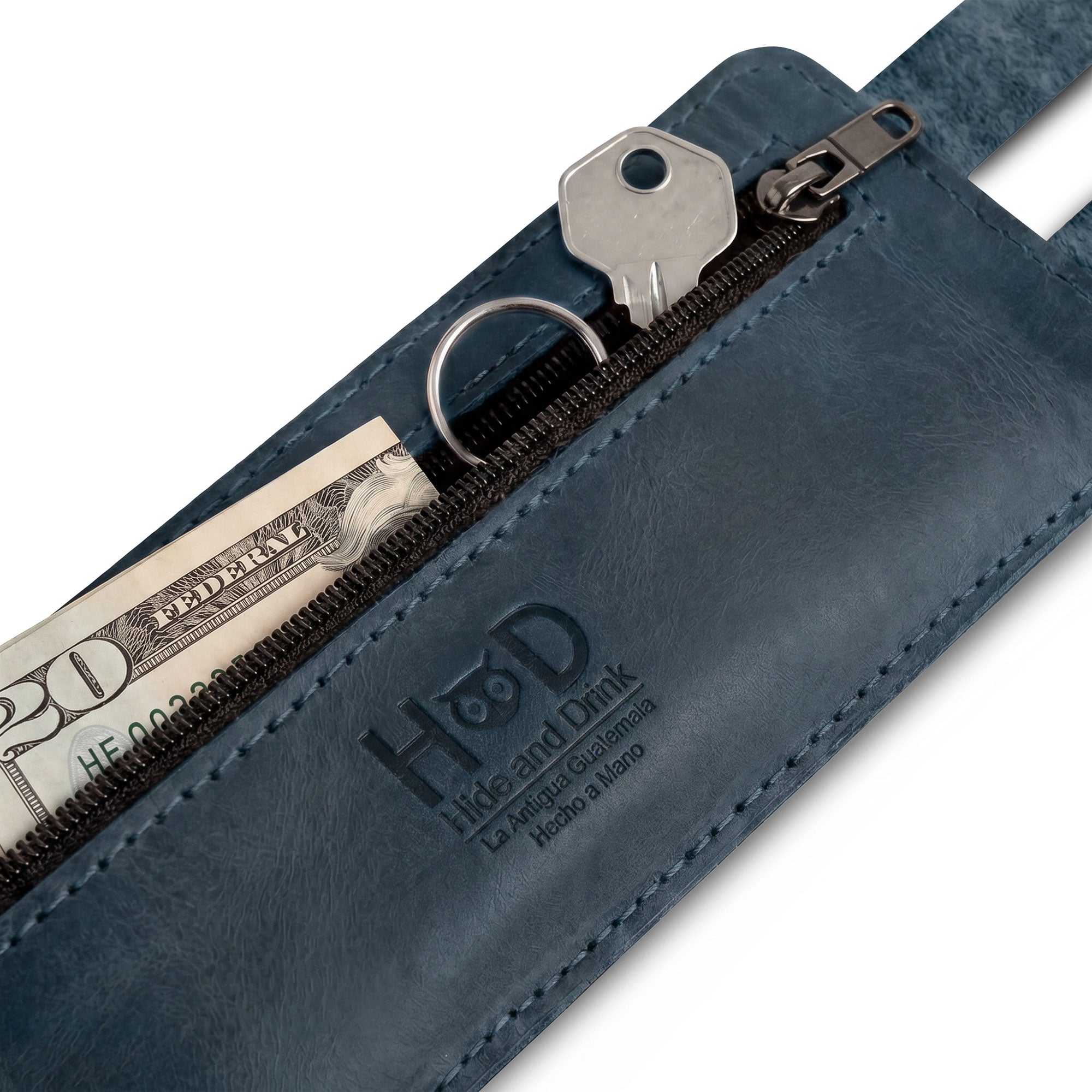 An artisan-crafted product, Hide & Drink's Wrist-Wallet-Cuff made from Full Grain Leather. This rustic leather bracelet features a hidden pouch for bills and an inner zippered pouch, merging style with practicality. Handmade in La Antigua Guatemala & Oaxaca Mexico, representing small batch production.
