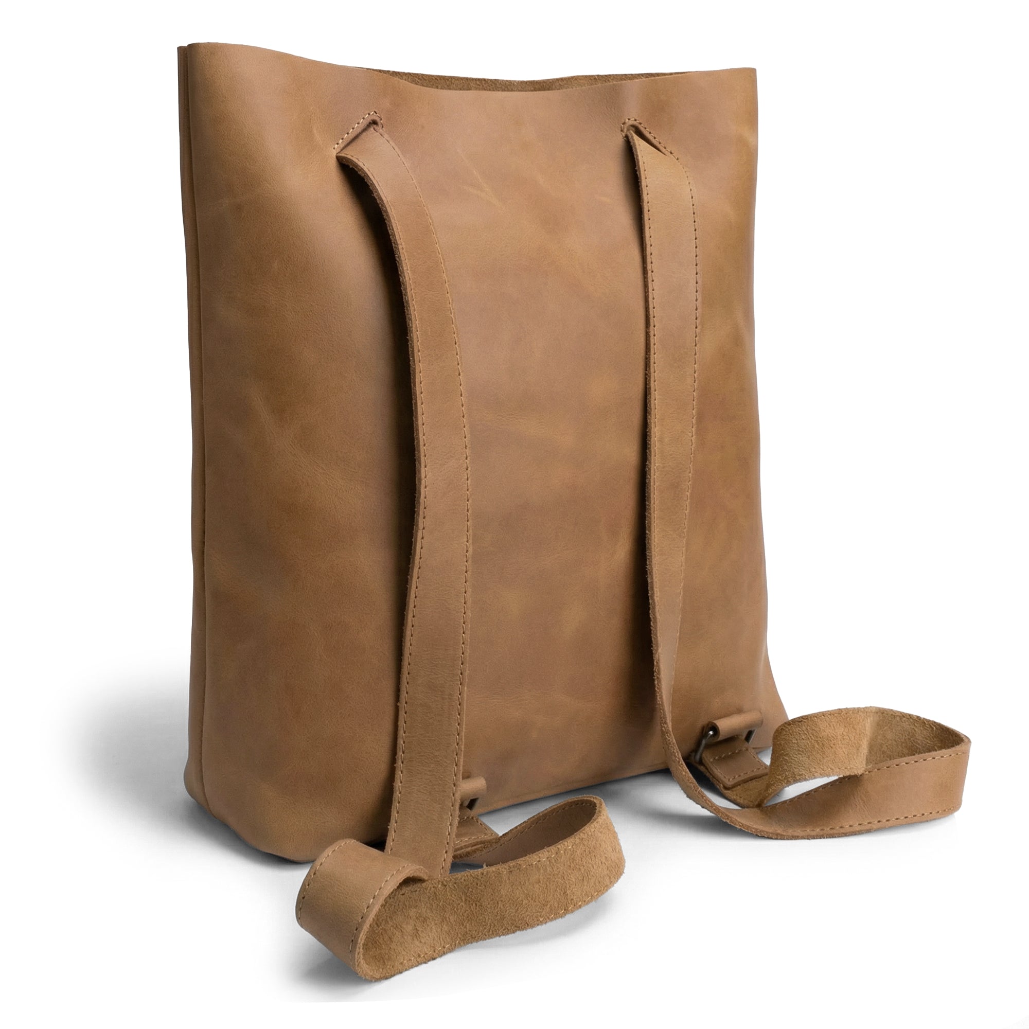 The back view of Heather's Convertible Backpack to Shoulder Bag, highlighting its sleek leather construction. This spacious crossbody for women is a squared purse crafted from Full Grain Leather, showcasing artisan quality. Handmade in La Antigua Guatemala and Oaxaca Mexico, it combines small batch production with hand cut and fire branded elements for unique style.