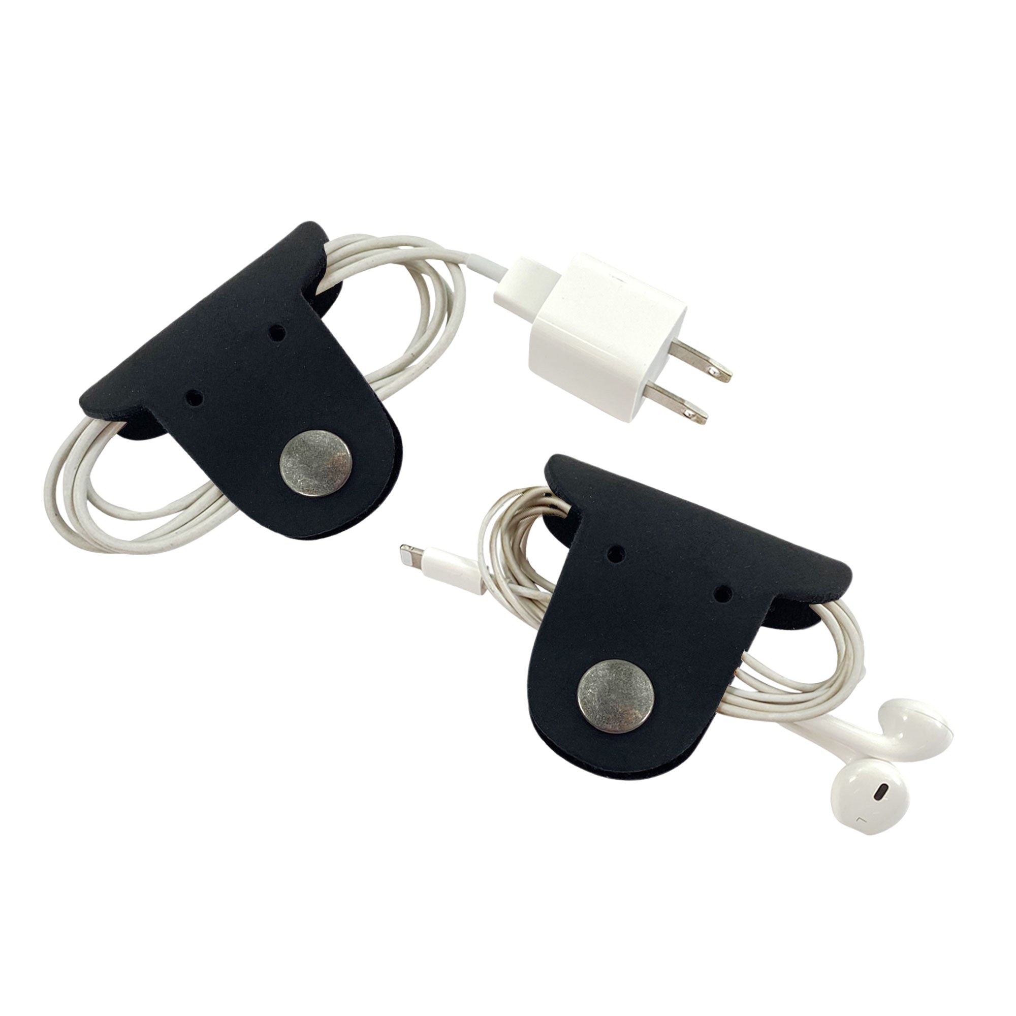 Wrap up your cables in style with Taco Dog's Dog Cord Keepers, perfect for organizing headphones and chargers. These full grain leather accessories feature durable clips for easy travel management. Experience artisan quality with each handmade piece from La Antigua Guatemala.