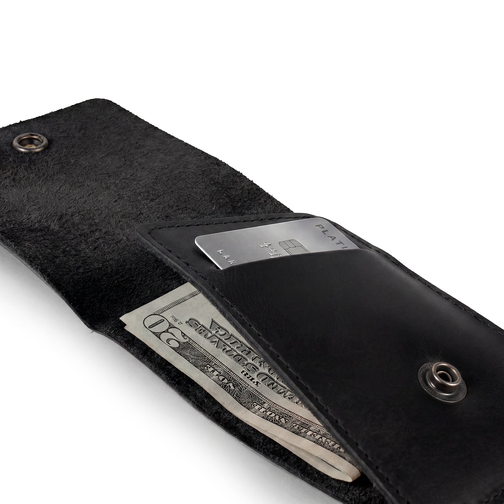 Opened black Vertical Wallet by Hide & Drink displaying card and cash slots, perfect for on-the-go storage. This Vertical Front Pocket Wallet with Card Slot ensures compactness while holding cash, made from full grain leather and emphasizing small batch production with hand cut and hand sewn finishes, fire branded for authenticity. Handmade in La Antigua Guatemala & Oaxaca Mexico.
