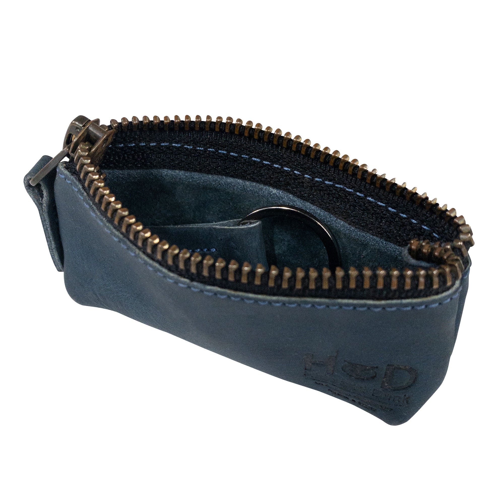 Hide & Drink Key Holder Zippered Pouch showcasing its practical use for everyday items, including coins and charging cables. Crafted in full grain leather, highlighting artisan dedication.