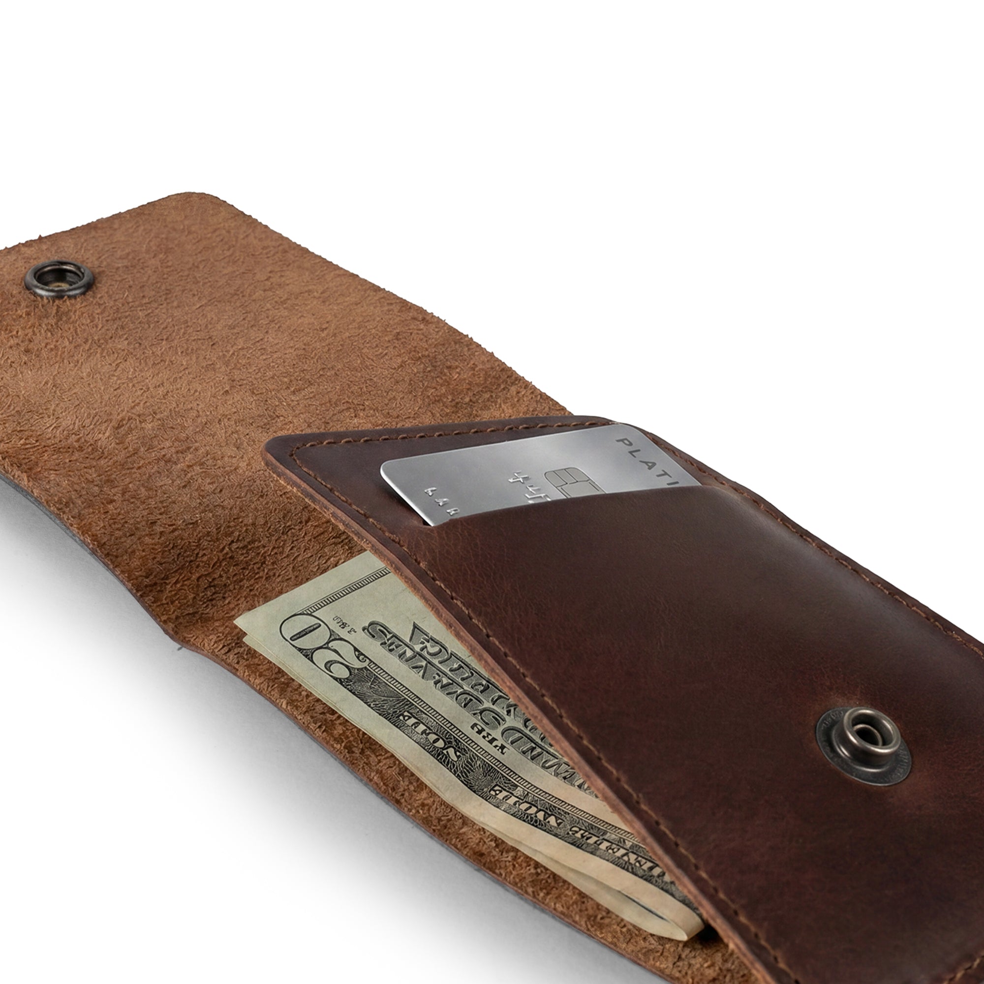 Opened Vertical Wallet by Hide & Drink, ideal for storing cash and cards, this Vertical Front Pocket Wallet with Card Slot ensures compact storage for bills and is designed as a card holder with durable full grain leather. It reflects craftsmanship from small batch production, hand cut, and hand sewn, fire branded by artisans in La Antigua Guatemala & Oaxaca Mexico.