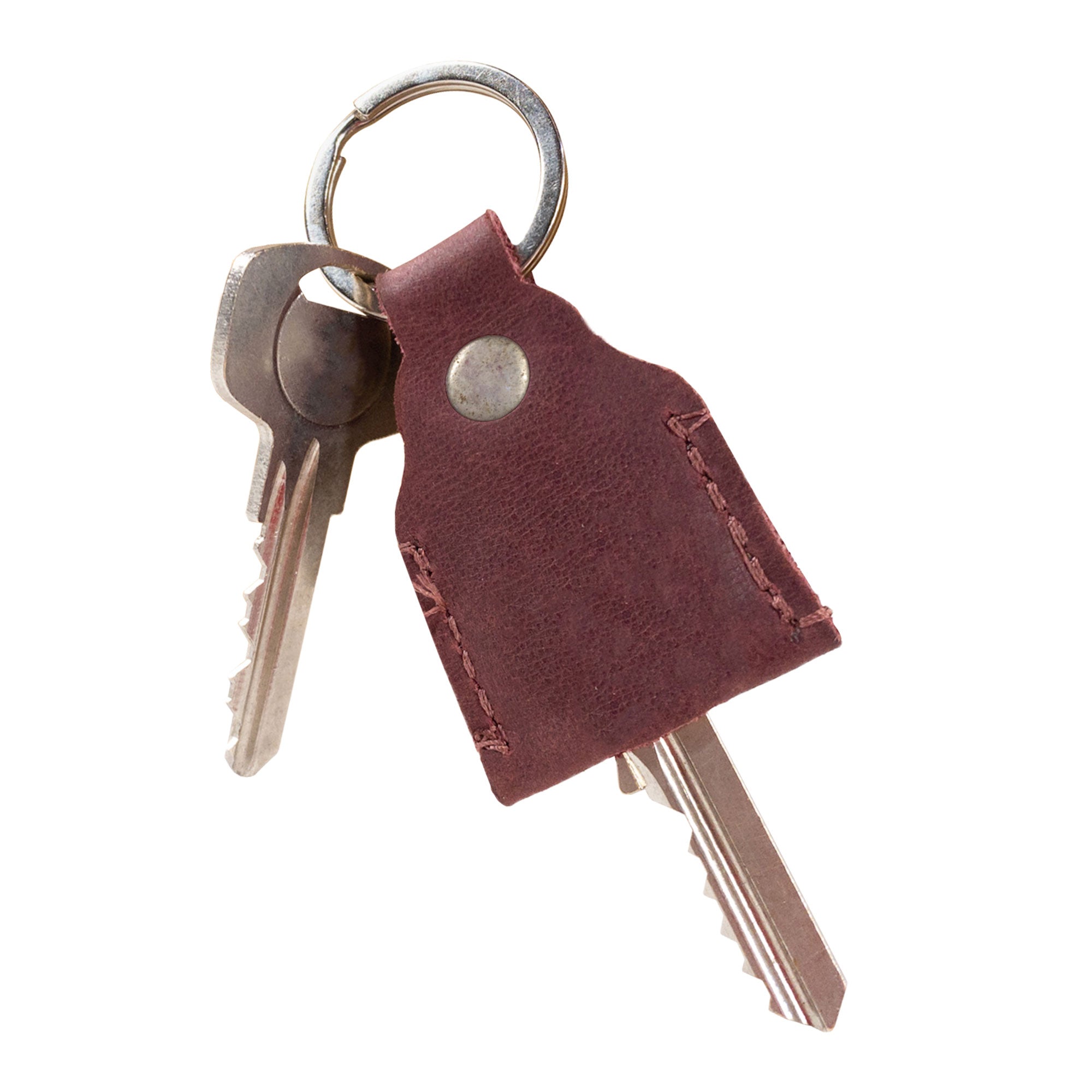 Reverse side view of burgundy Hide & Drink Key Holder showing the brand logo. This Key Holder combines functionality as a Keychain Organizer and emergency coin pouch, made beautifully in Full Grain Leather. Handmade in La Antigua Guatemala & Oaxaca Mexico with a focus on quality.