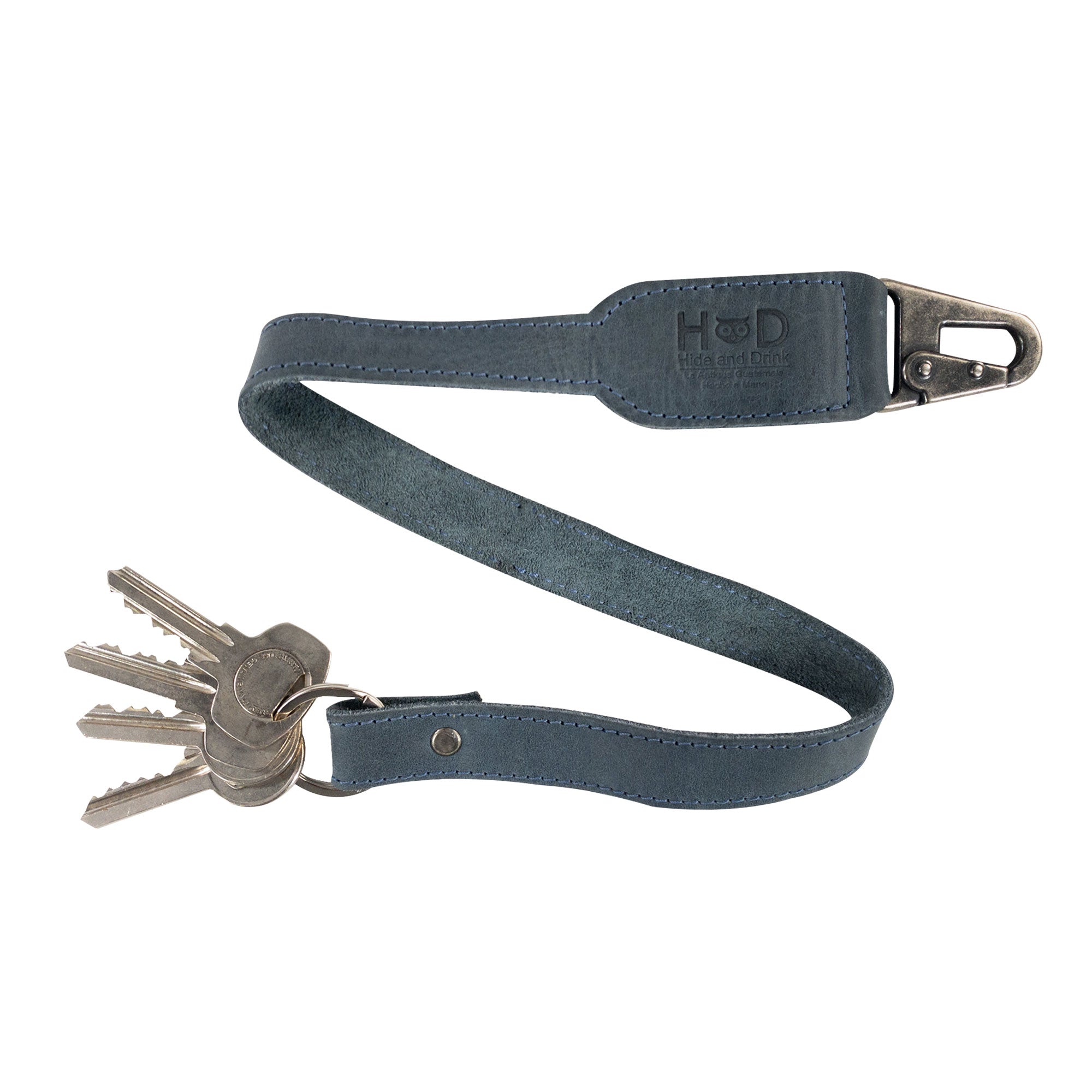 Hide & Drink Keychain Lanyard, an elegant and durable accessory created from Full Grain Leather. The convenient clip allows for easy attachment of keys, emphasizing artisan production quality.