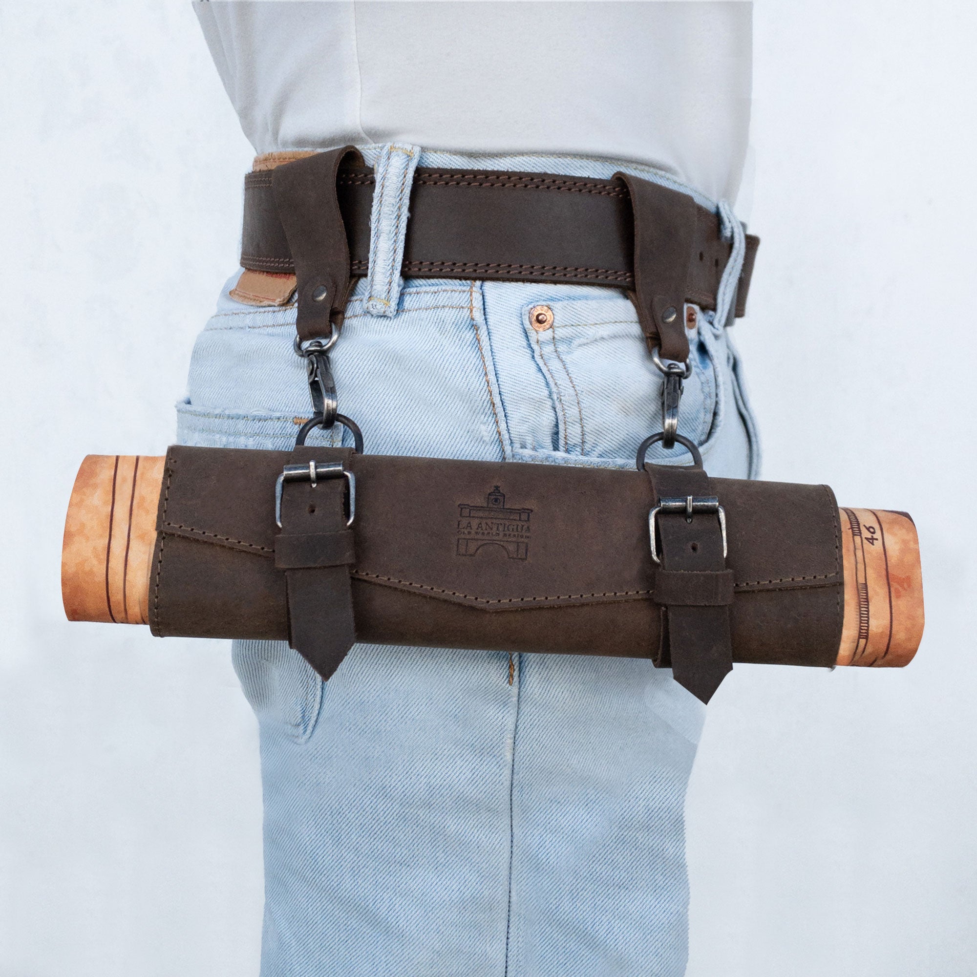 Stylish and functional, La Antigua's Map Holder for Belt is showcased worn on a belt, highlighting its rustic aesthetic and sturdy construction. This heavy-duty, full grain leather multitool organizer exemplifies artisan craftsmanship with hand cut, hand sewn design, and fire branding, made in La Antigua Guatemala & Oaxaca Mexico.