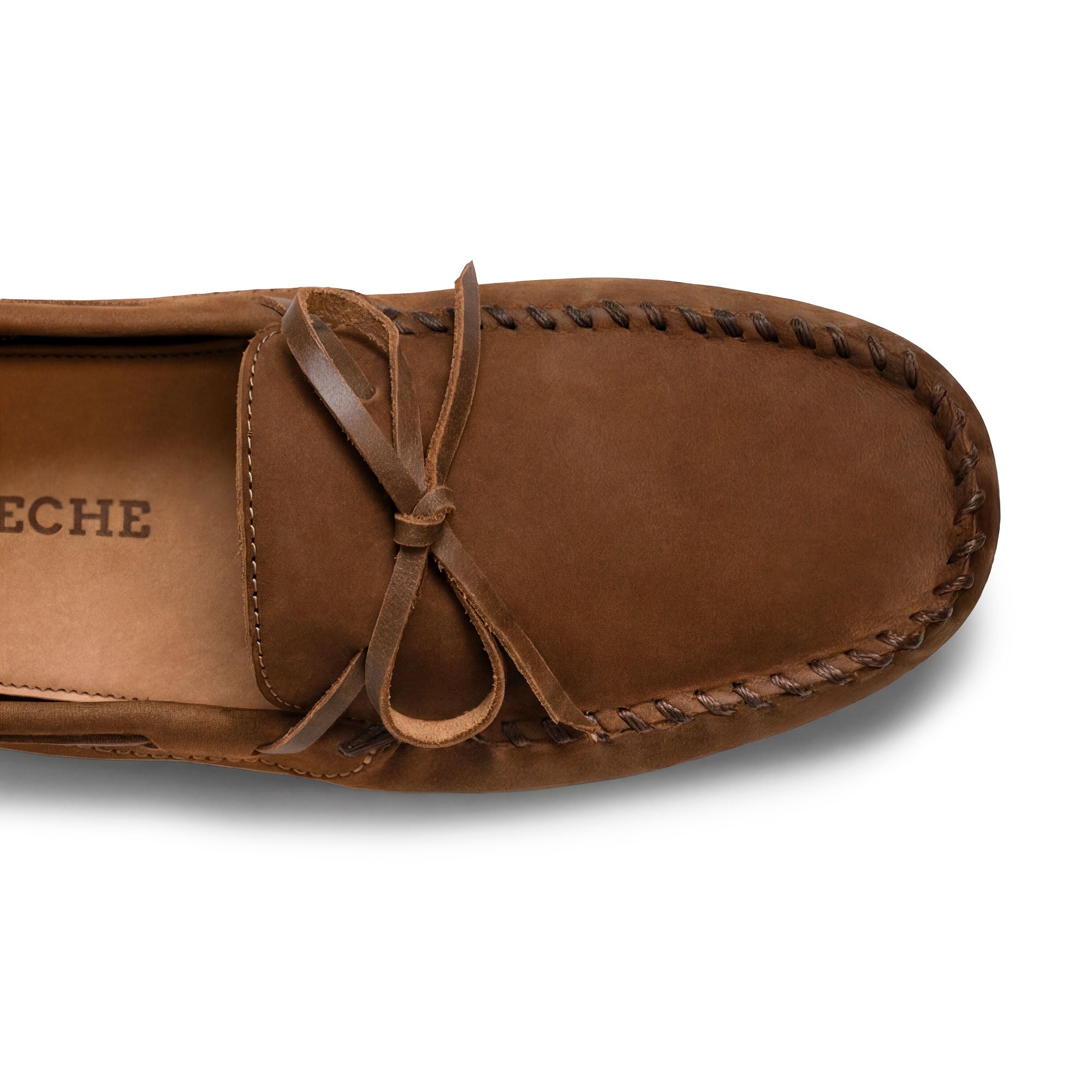 Close-up view of The Roadster Leather Driving Moccasins by La Leche, highlighting the soft Full Grain Leather upper and intricate hand sewn stitching. An artisan creation made in La Antigua Guatemala & Oaxaca Mexico.