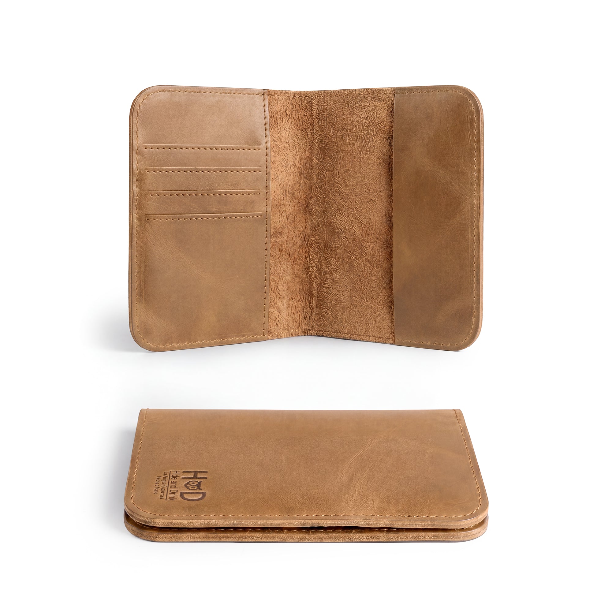 Inside view of the Hide & Drink Travel Wallet featuring card slots and a money pocket. A perfect travel wallet, this men’s bifold passport case is handcrafted from durable full grain leather in La Antigua Guatemala.
