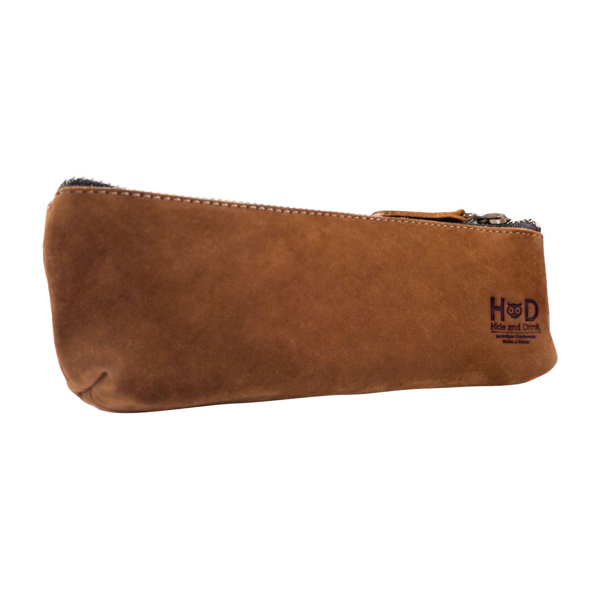 Side profile of Hide & Drink’s Pencil Pouch made from full grain leather. This rectangular pencil case serves as a pen & marker pouch for men and women, featuring a practical flat zippered holder design. Artisan-made in La Antigua Guatemala & Oaxaca Mexico, showcasing the hallmark of small batch production.
