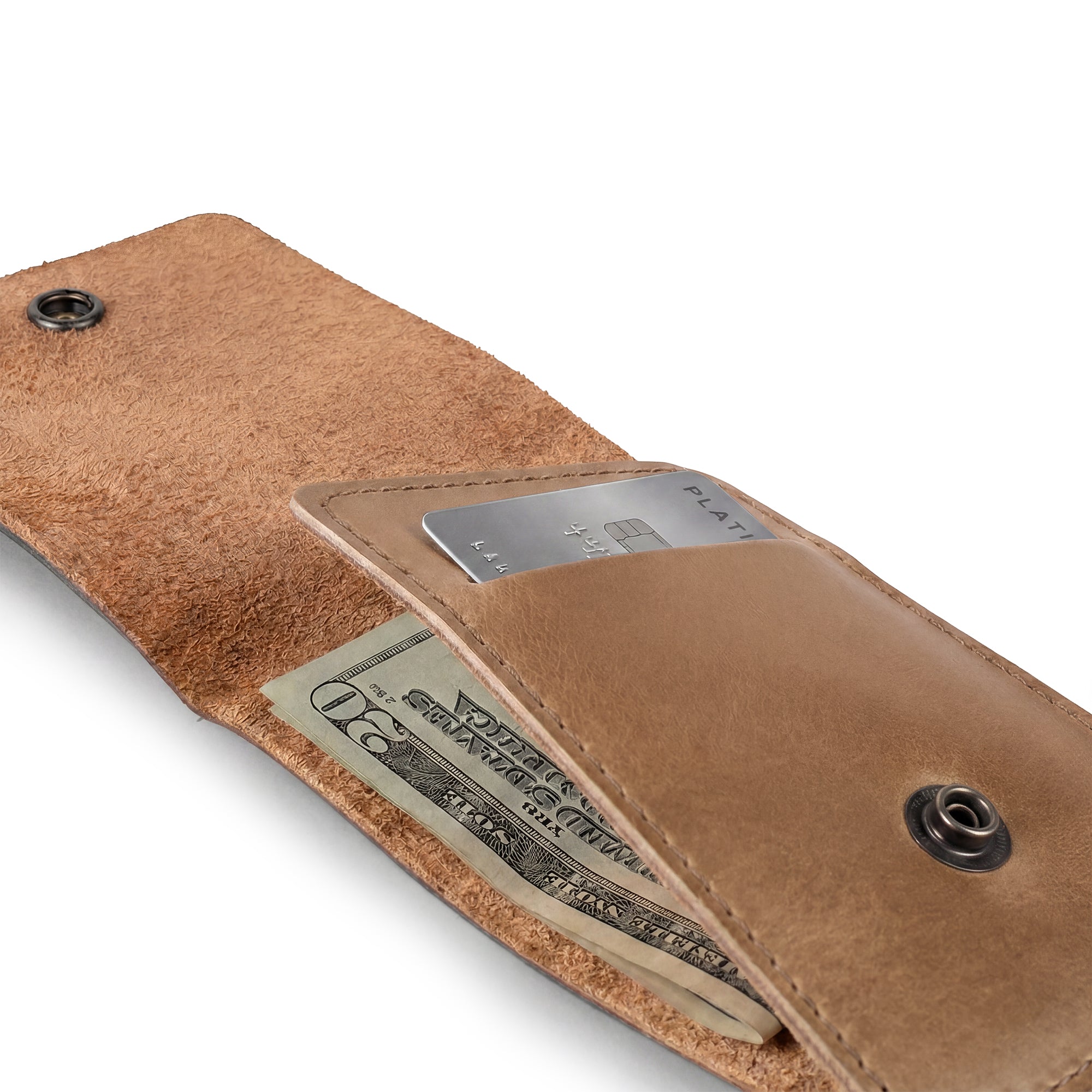 Back view of the brown Vertical Wallet by Hide & Drink featuring the embossed brand logo prominently. This Vertical Front Pocket Wallet with Card Slot combines elegance and functionality, designed for compact storage for bills and cards, made from high-quality full grain leather with small batch production methods, hand cut, hand sewn, and fire branded. Handmade in La Antigua Guatemala & Oaxaca Mexico.